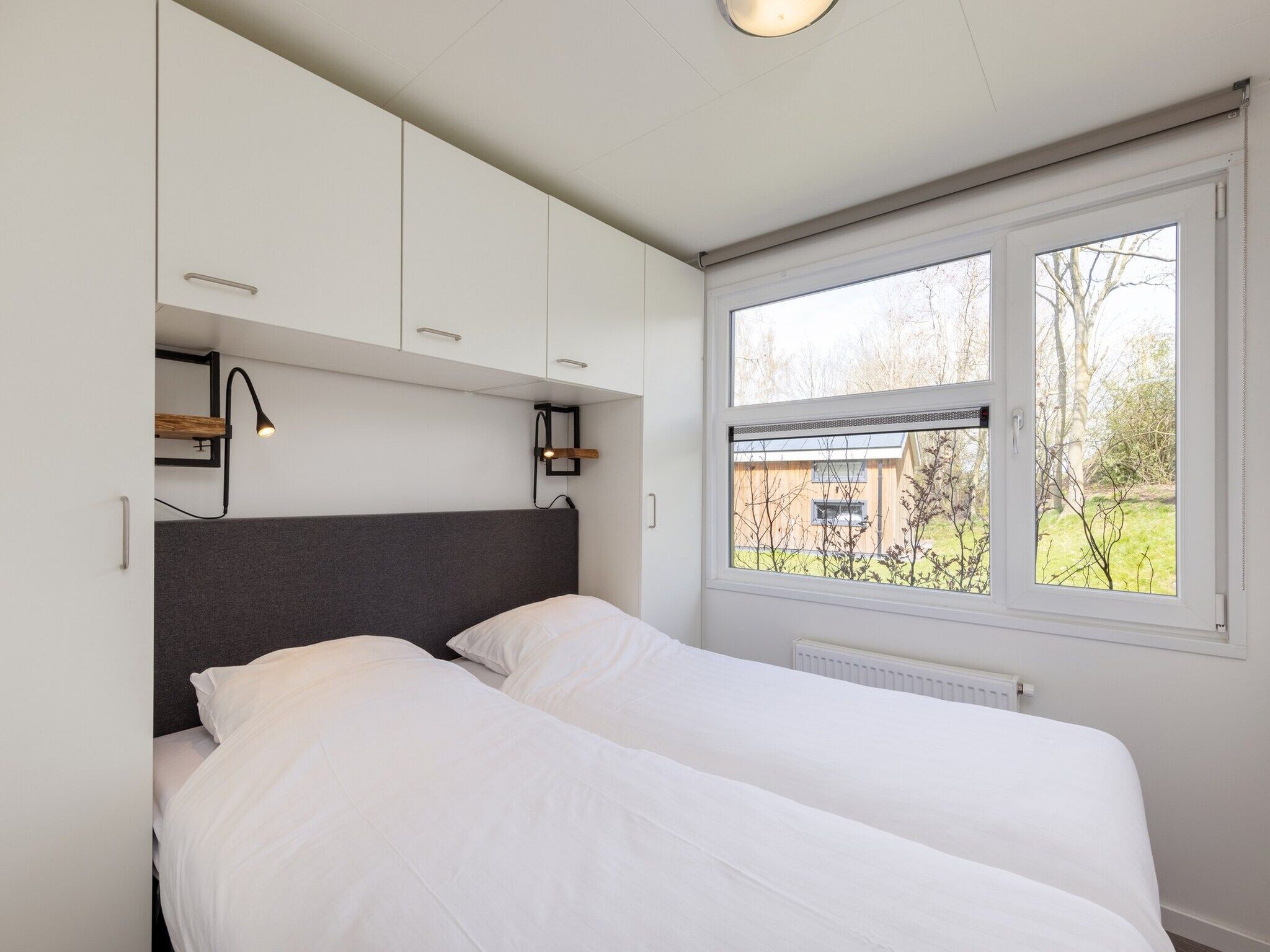 Een slaapkamer van Recreatiepark Tolplas 18 in Hoge Hexel