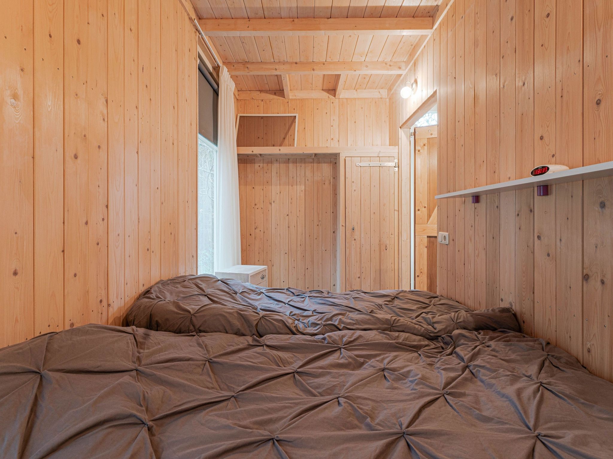 Een slaapkamer van Boshuis De Klim in Norg