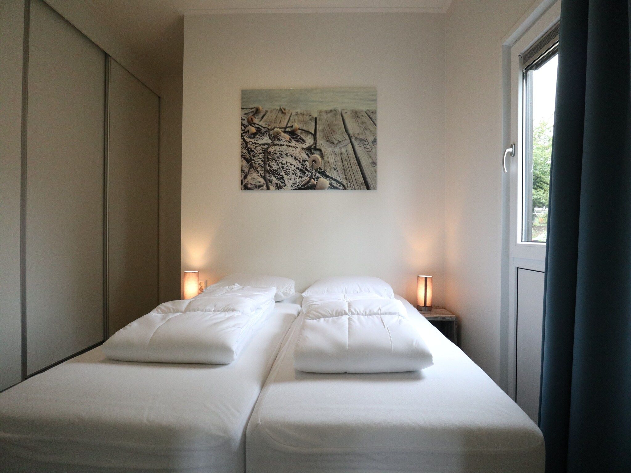 Een slaapkamer van Cube la Mer 4 in Olburgen
