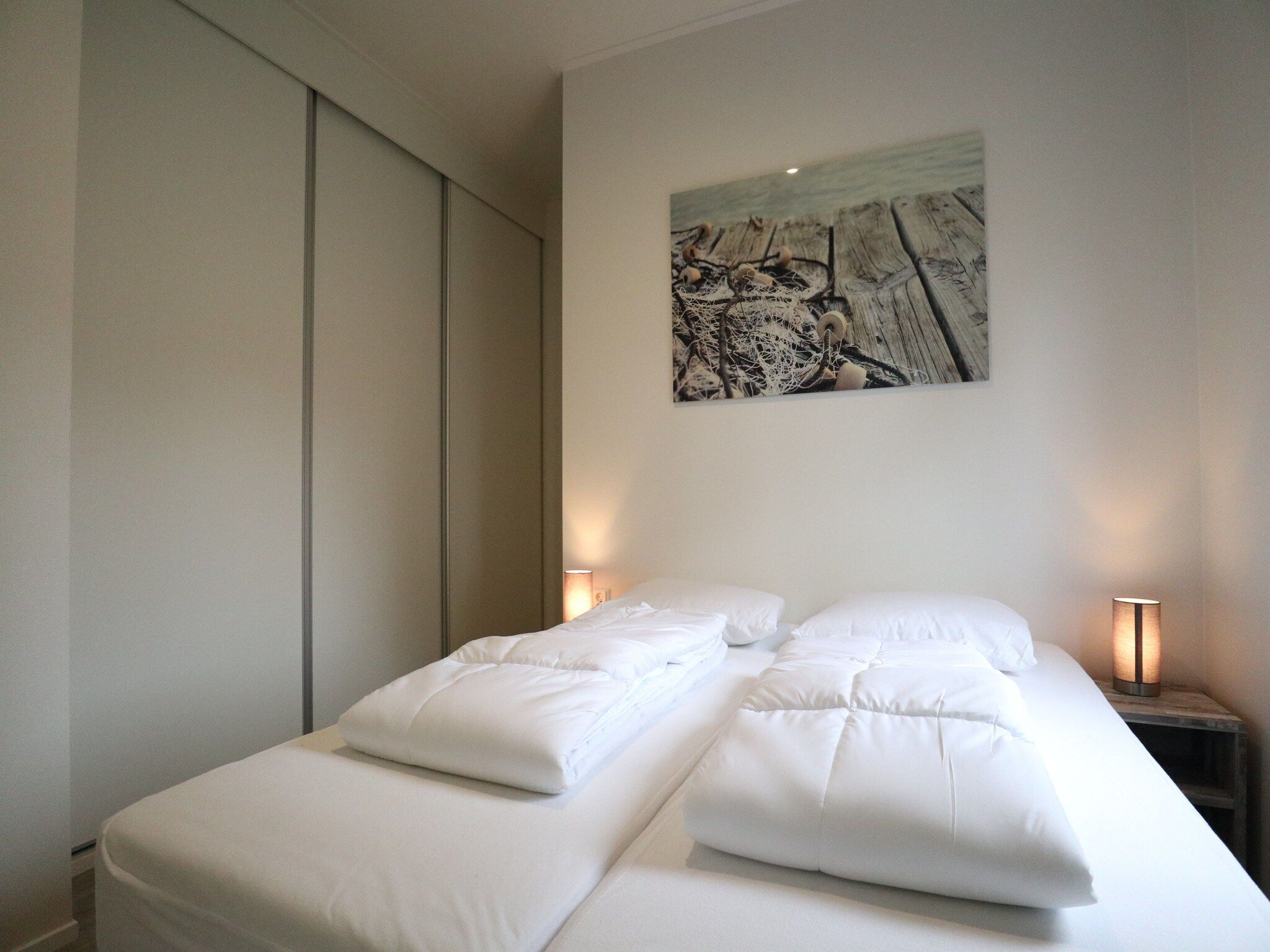 Een slaapkamer van Cube la Mer 4 in Olburgen