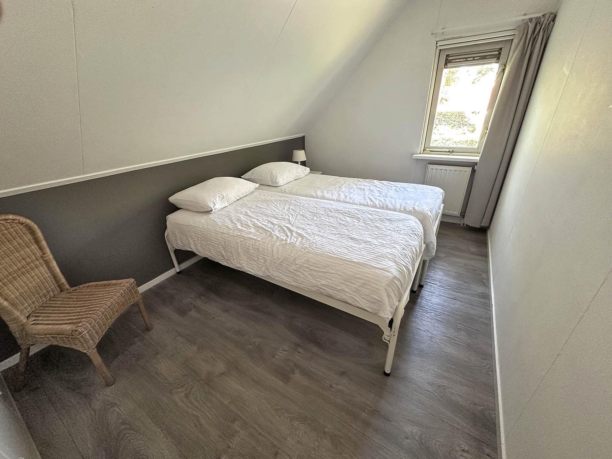 Een slaapkamer van Buitenplaats Berg en Bos nummer 4 in Lemele