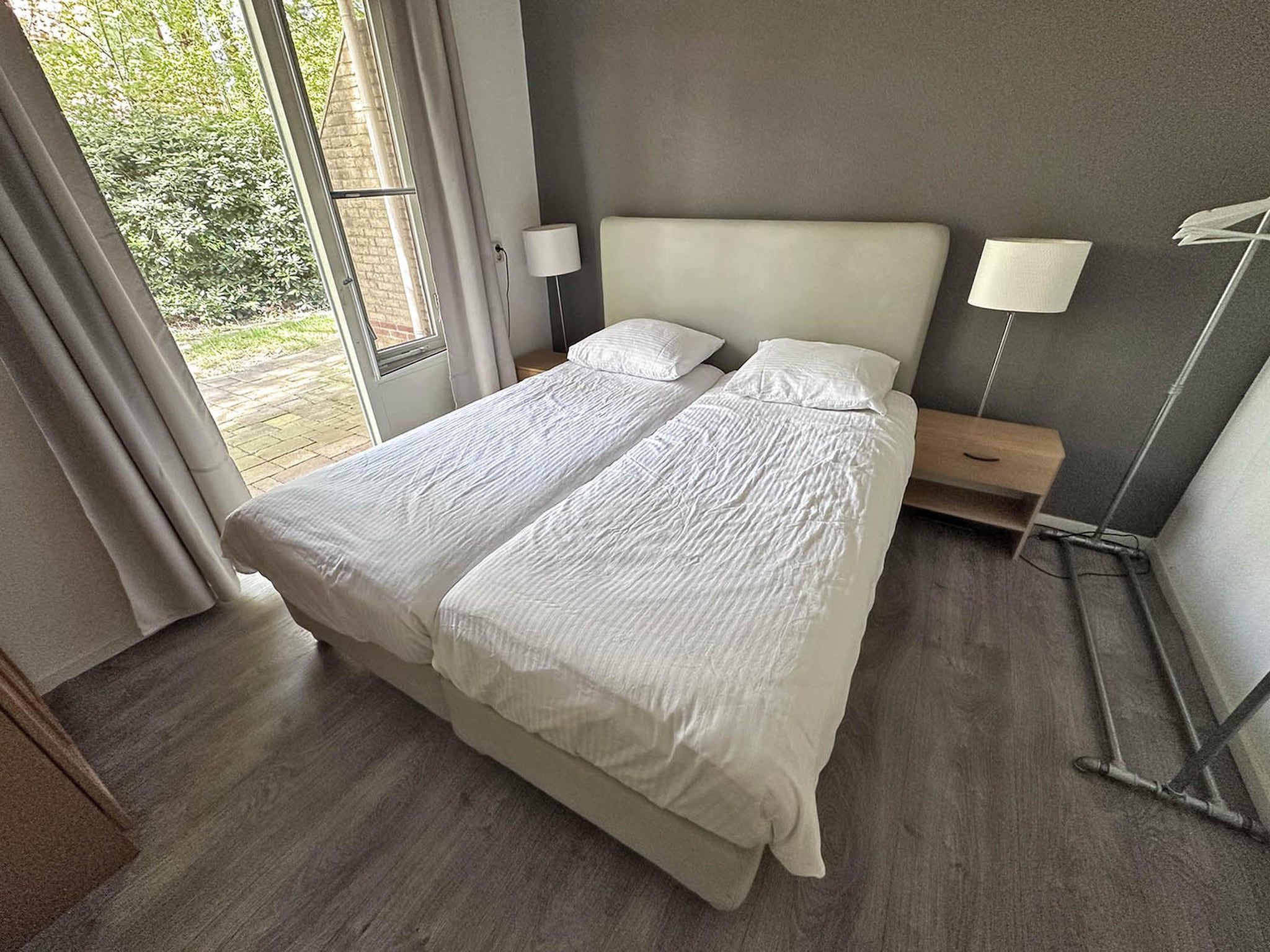Een slaapkamer van Buitenplaats Berg en Bos nummer 4 in Lemele