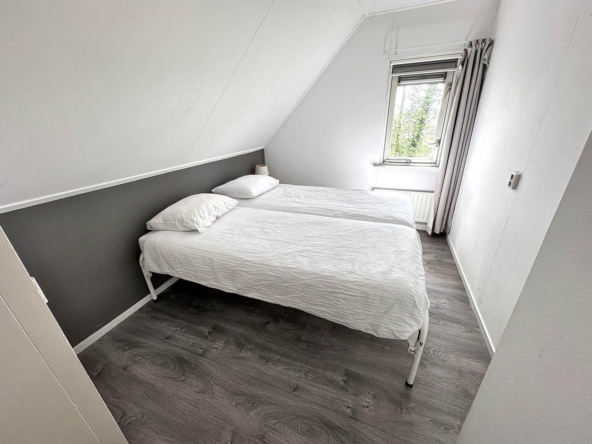 Een slaapkamer van Buitenplaats Berg en Bos nummer 4 in Lemele
