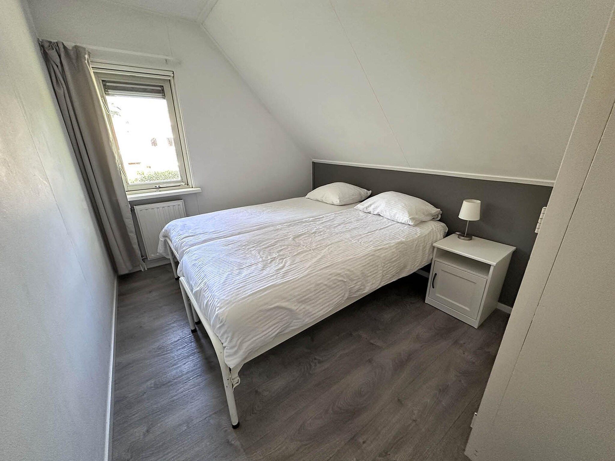 Een slaapkamer van Buitenplaats Berg en Bos nummer 4 in Lemele