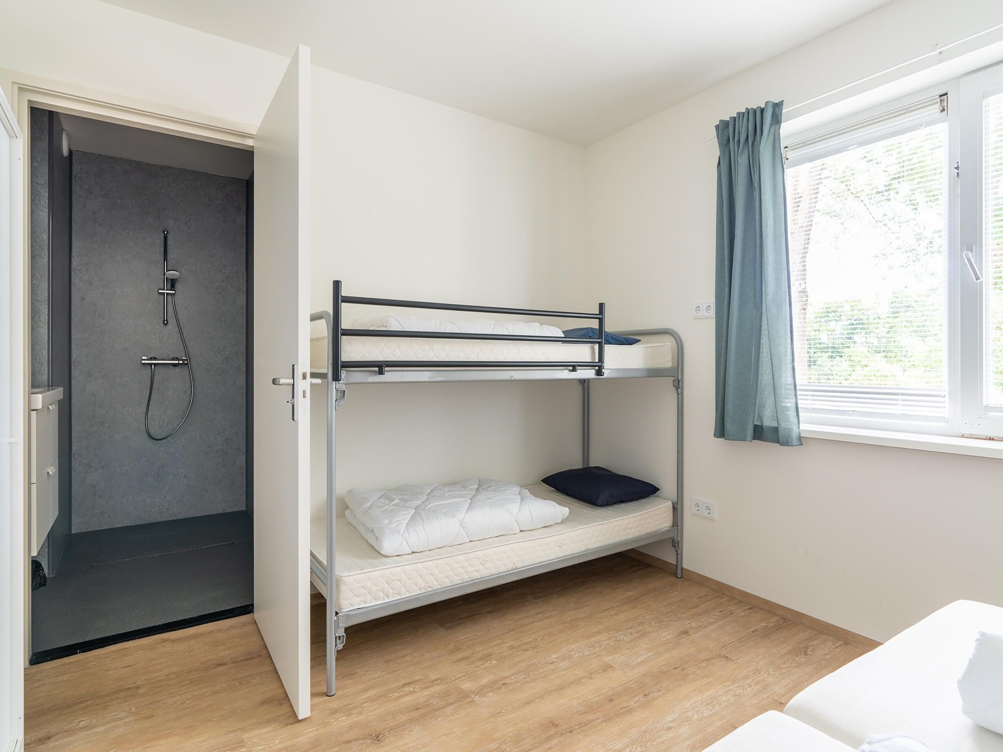 Een slaapkamer van Vrijersduin in Nes