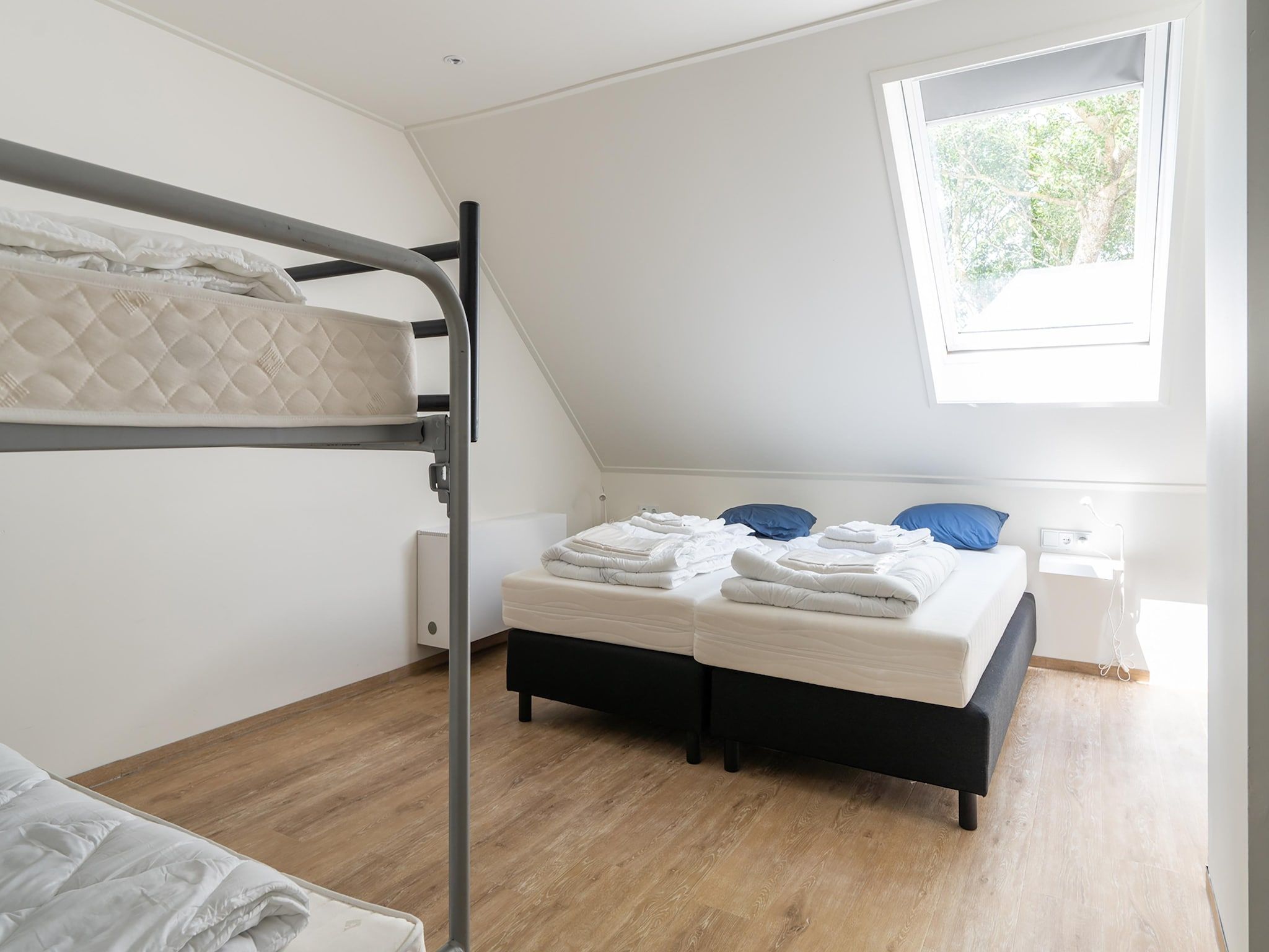 Een slaapkamer van Kaapsduin in Nes
