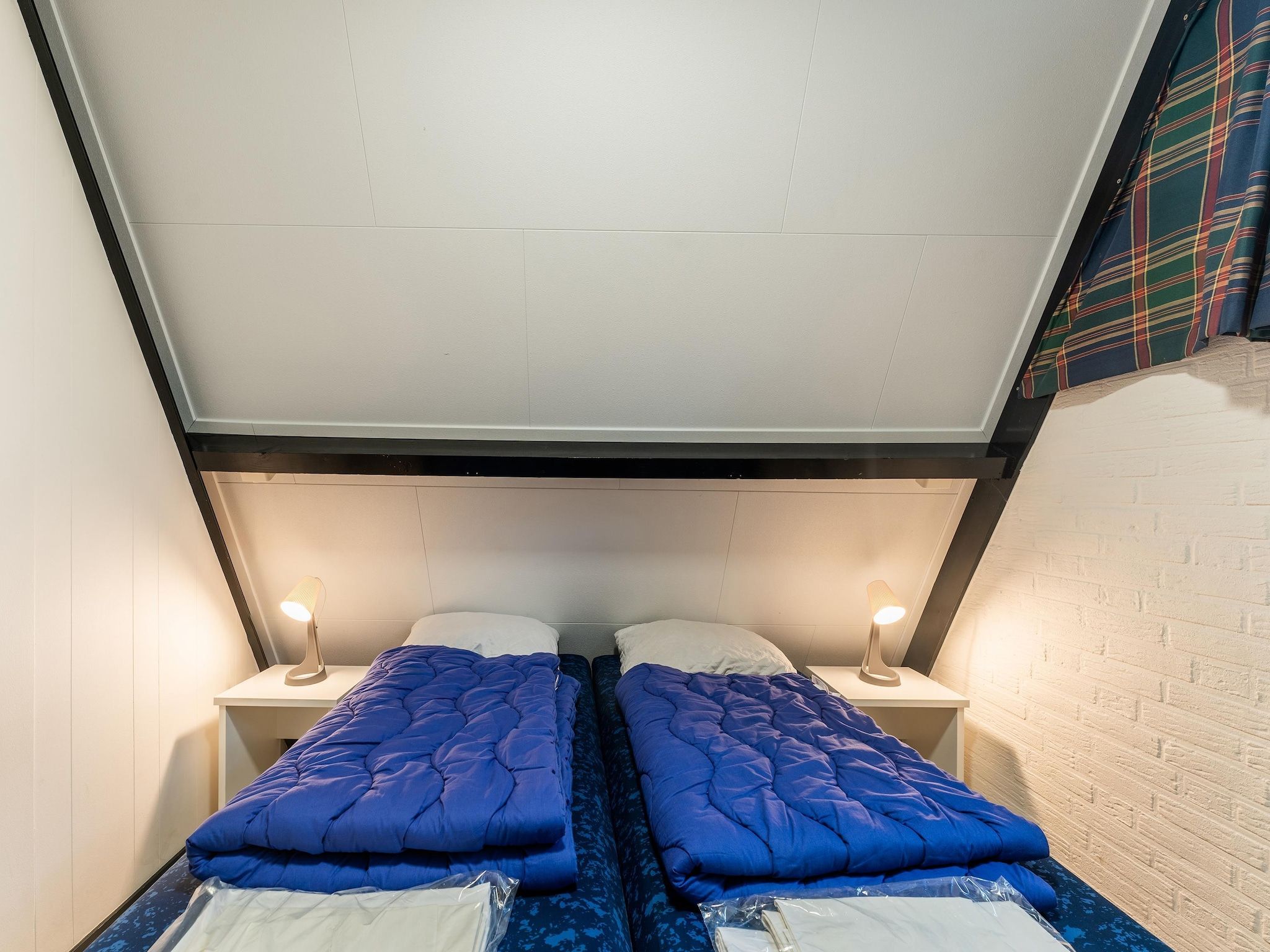 Een slaapkamer van Vosseven 54 Albatros in Stramproy