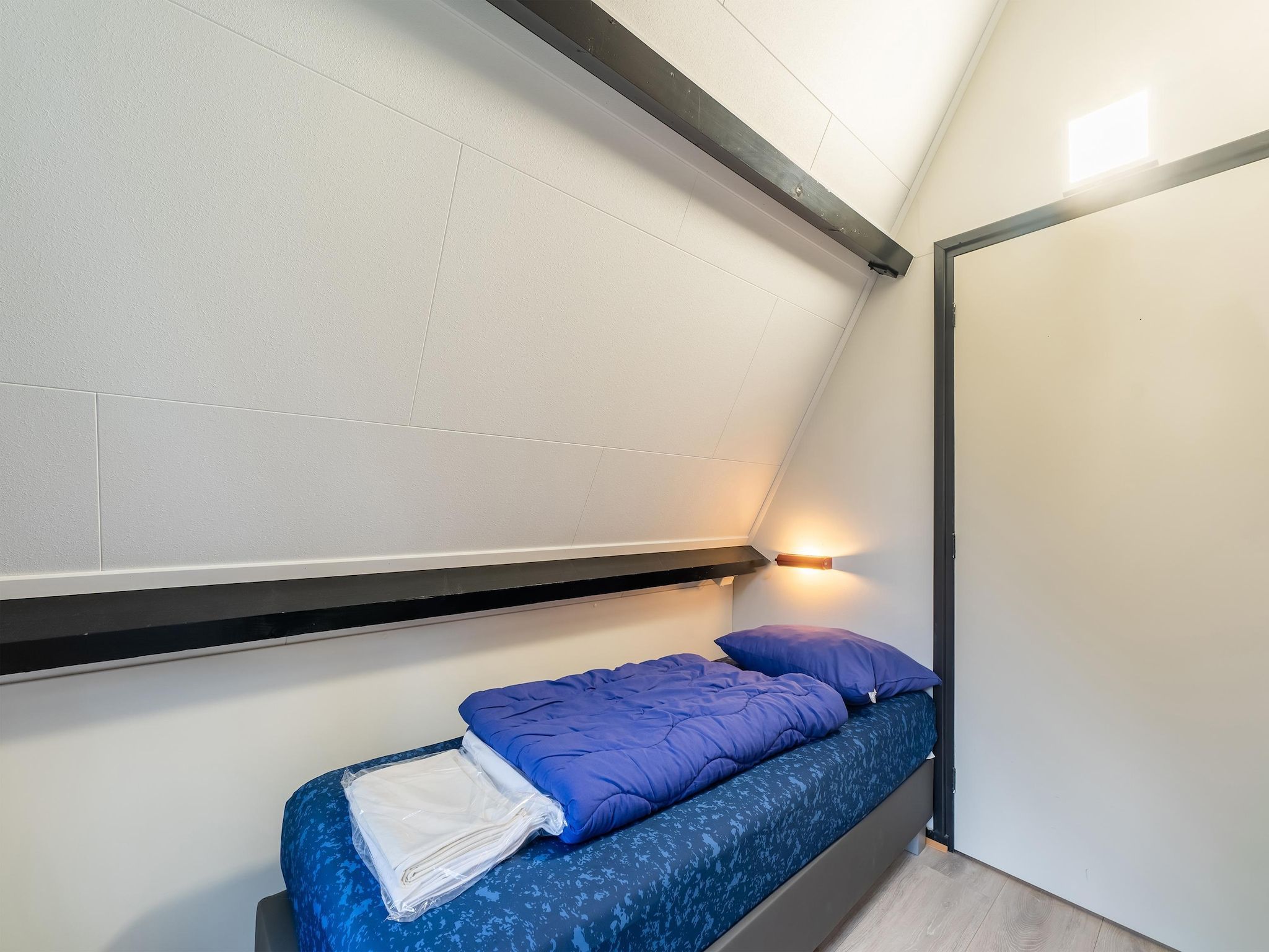 Een slaapkamer van Vosseven 54 Albatros in Stramproy