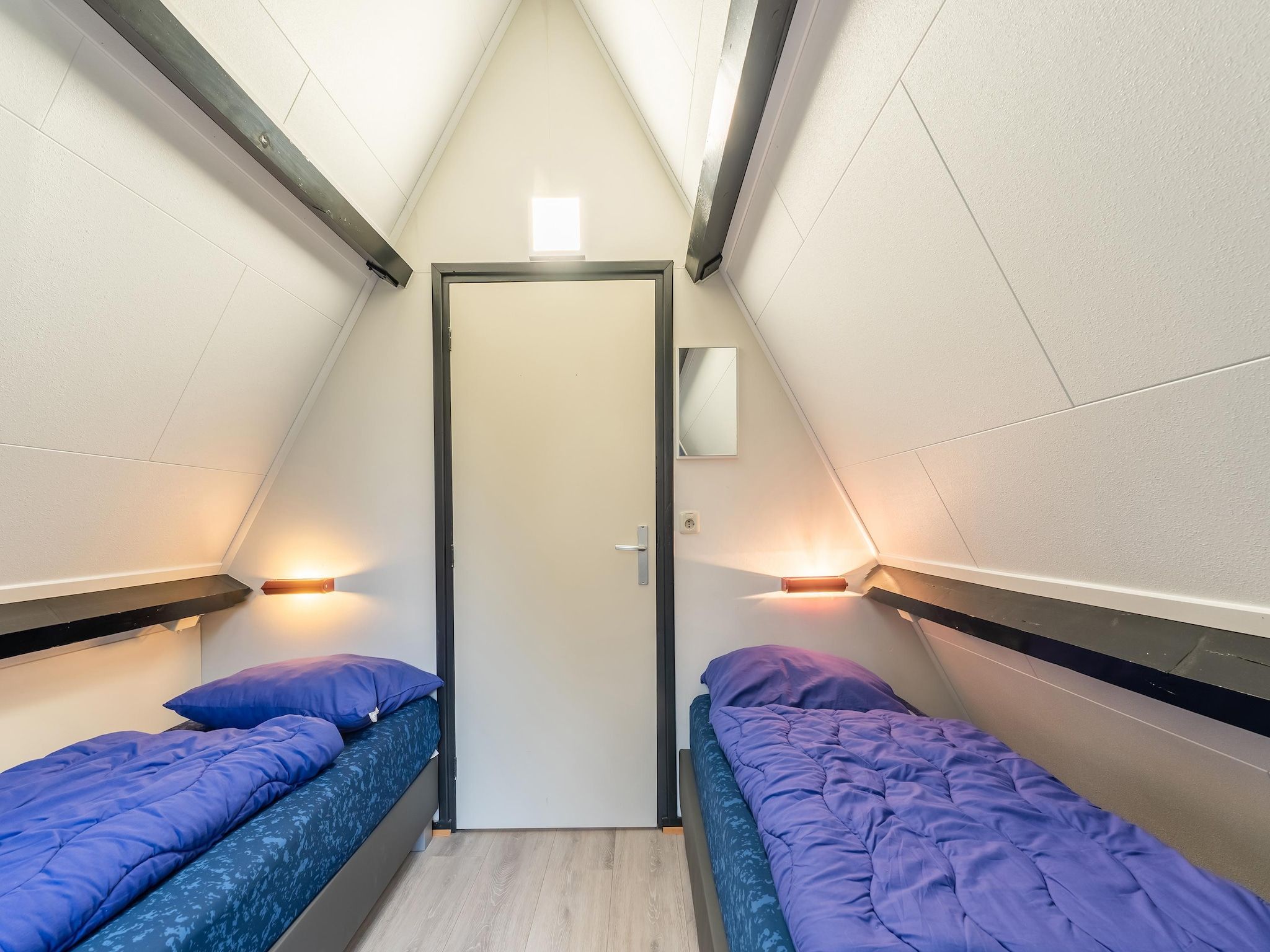 Een slaapkamer van Vosseven 54 Albatros in Stramproy