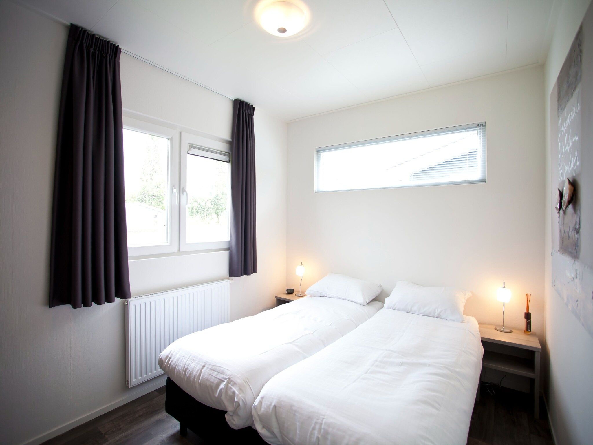 Een slaapkamer van Exclusif 4 in Breskens