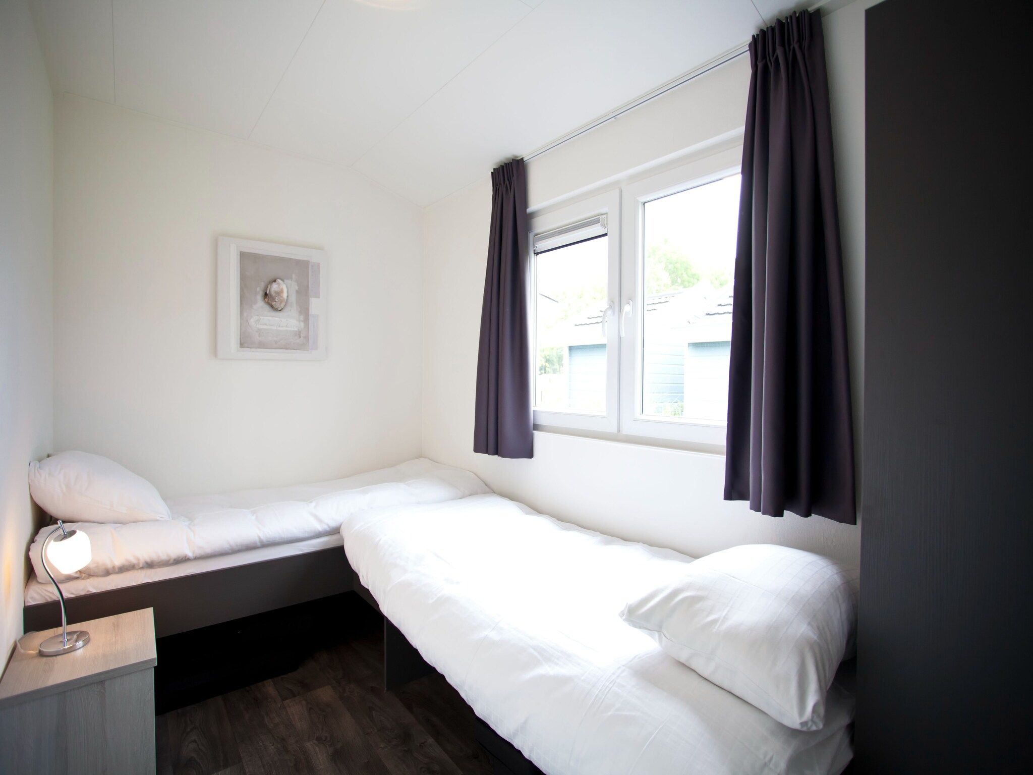 Een slaapkamer van Exclusif 4 in Breskens