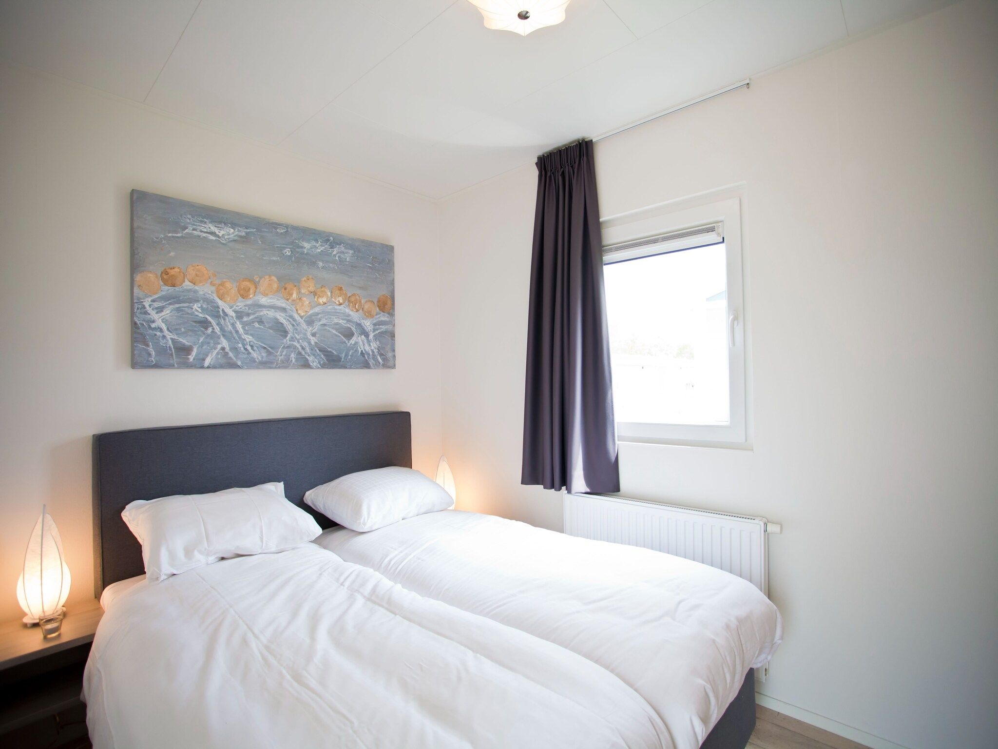 Een slaapkamer van Unique 4 in Breskens