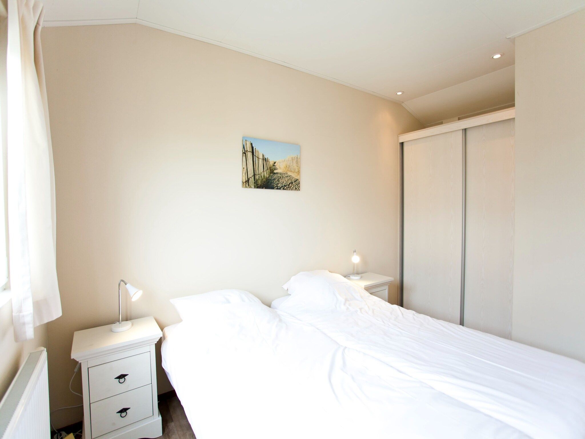 Een slaapkamer van Unique Luxe 4 in Breskens
