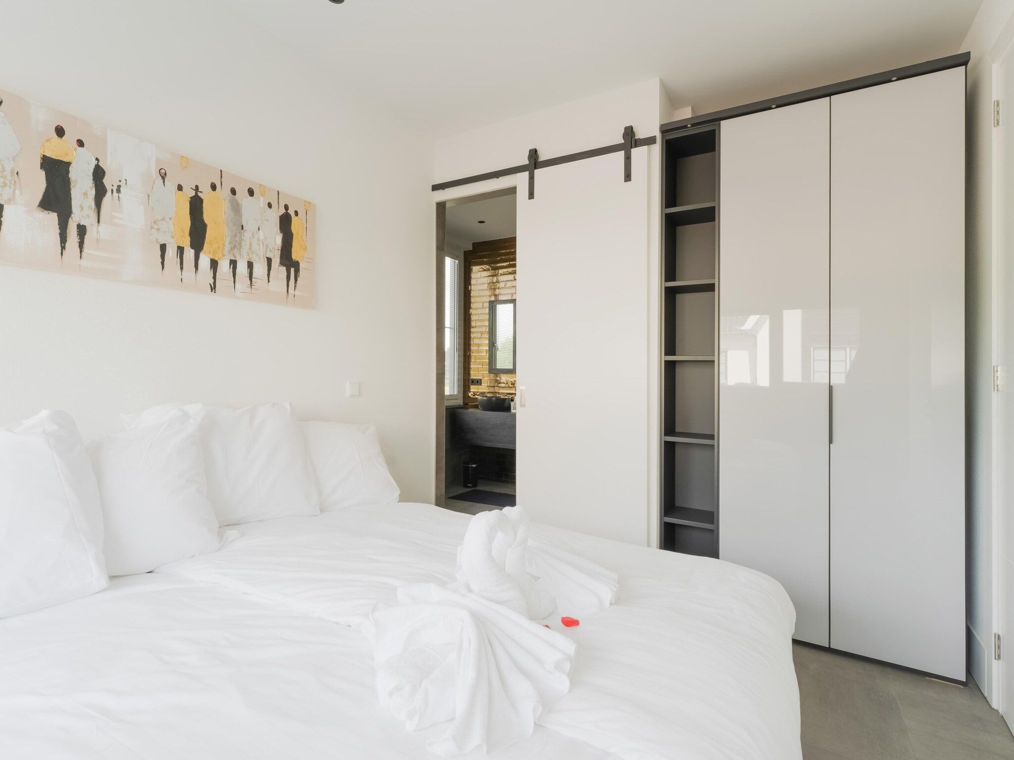 Een slaapkamer van Luxe villa aan het water in Stavoren
