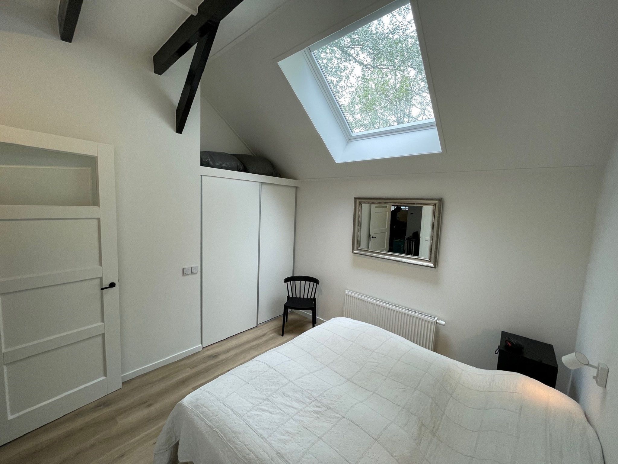 Een slaapkamer van Vakantiepark de Tabaksschuur 4 in Elst