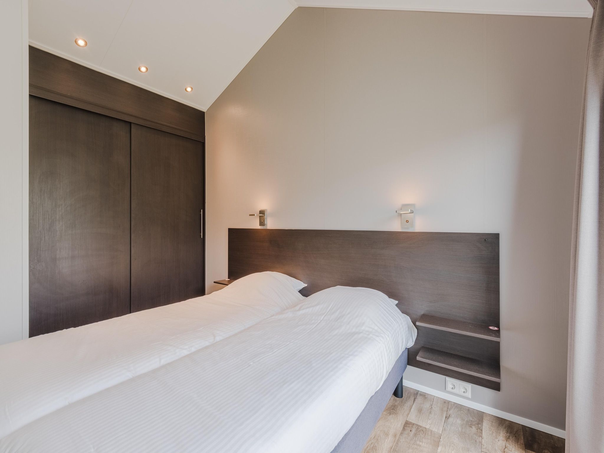 Een slaapkamer van Vakantiepark Giethoorn 8 in Giethoorn