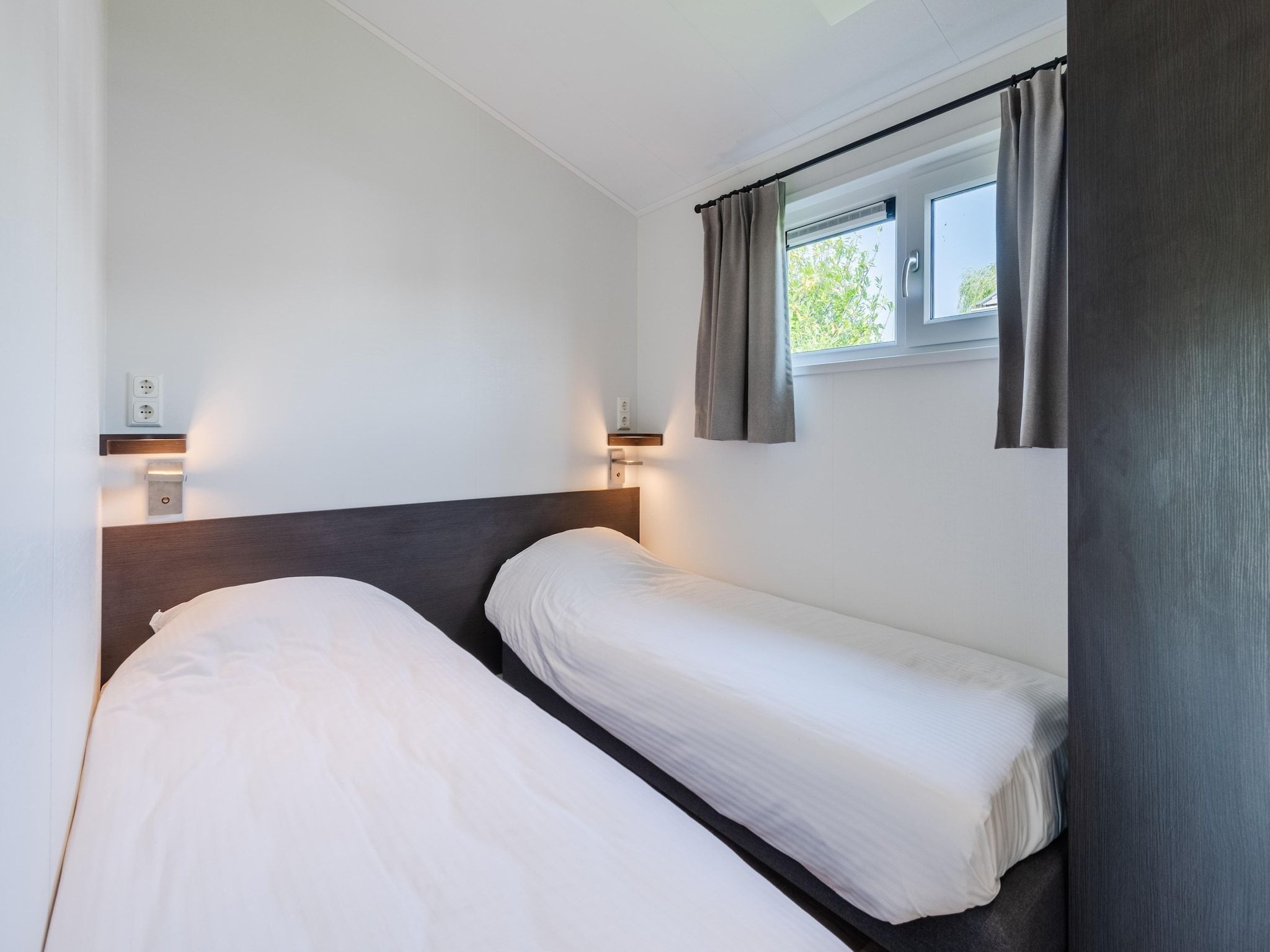 Een slaapkamer van Vakantiepark Giethoorn 10 in Giethoorn