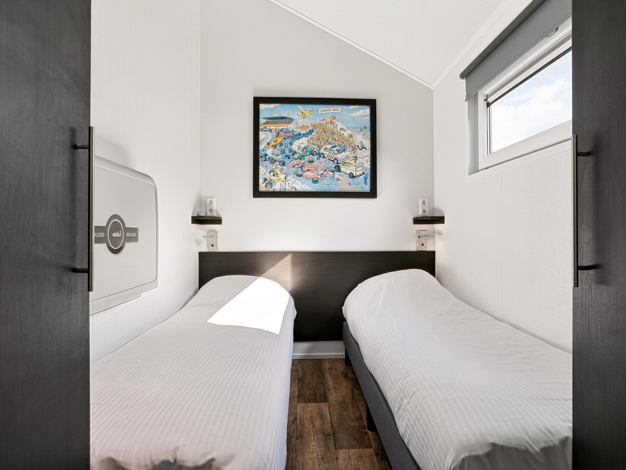 Een slaapkamer van Vakantiepark Giethoorn 12 in Giethoorn