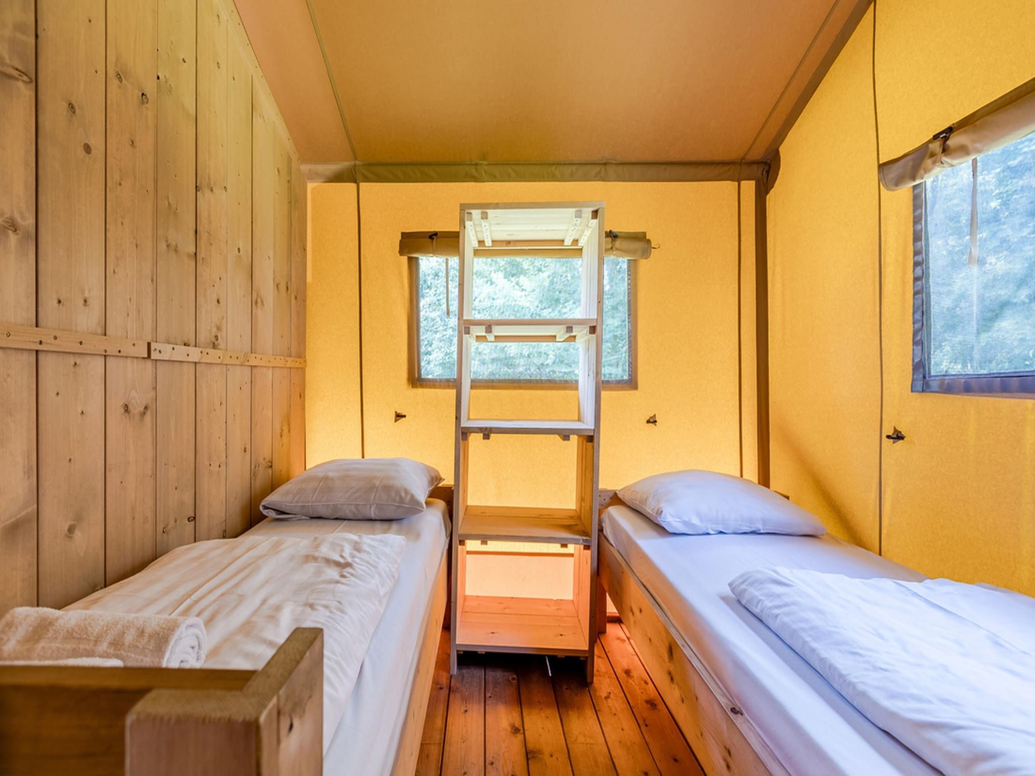 Een slaapkamer van Vakantiepark de Katjeskelder 22 in Oosterhout
