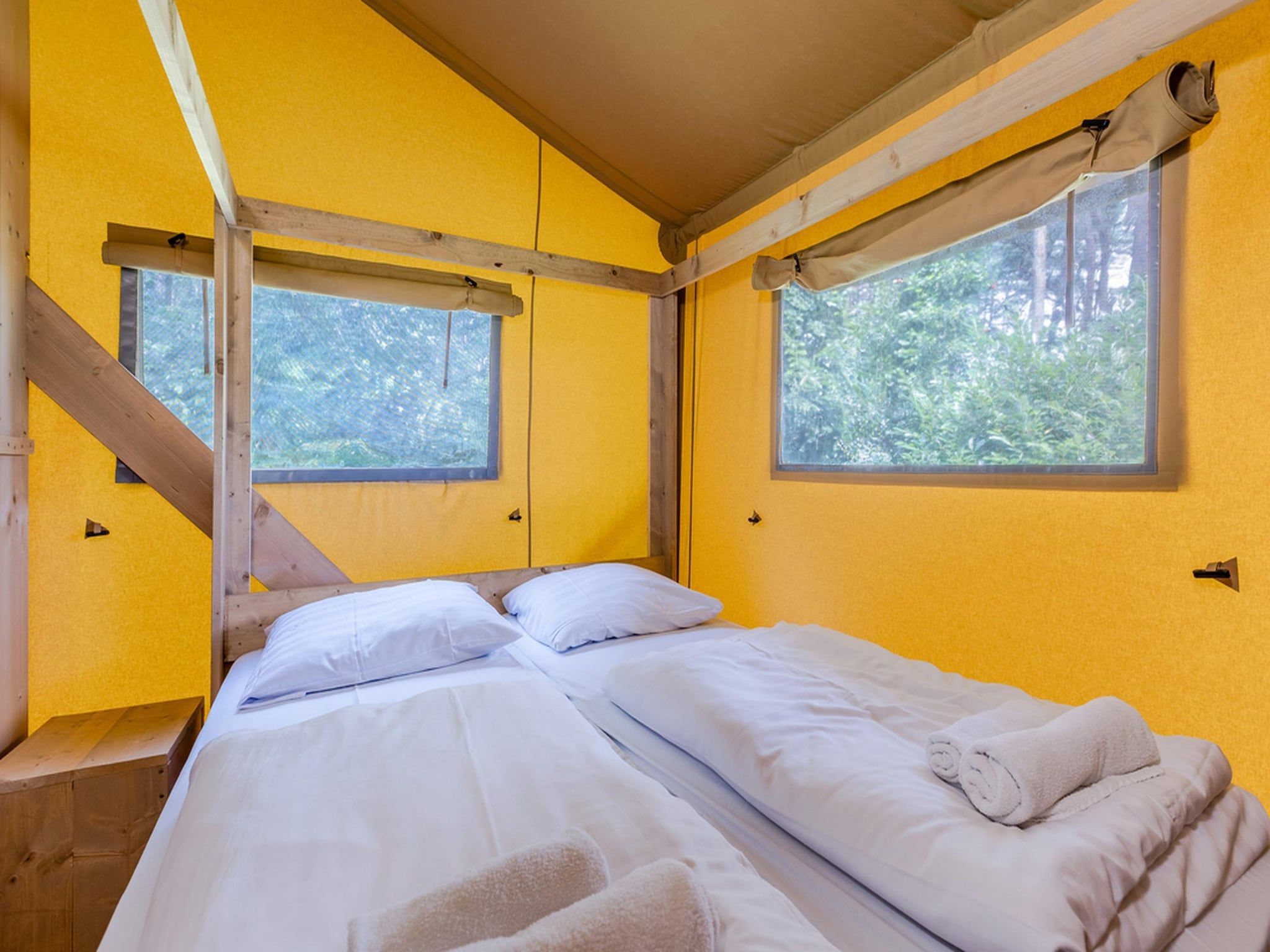 Een slaapkamer van Vakantiepark de Katjeskelder 22 in Oosterhout