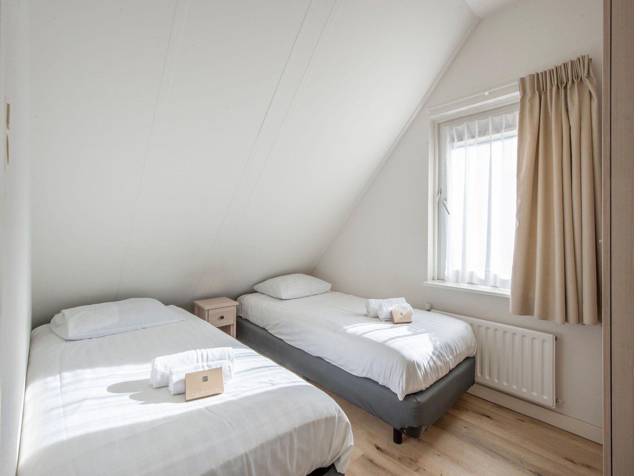 Een slaapkamer van Vakantiepark Zeeland Village 4 in Scharendijke