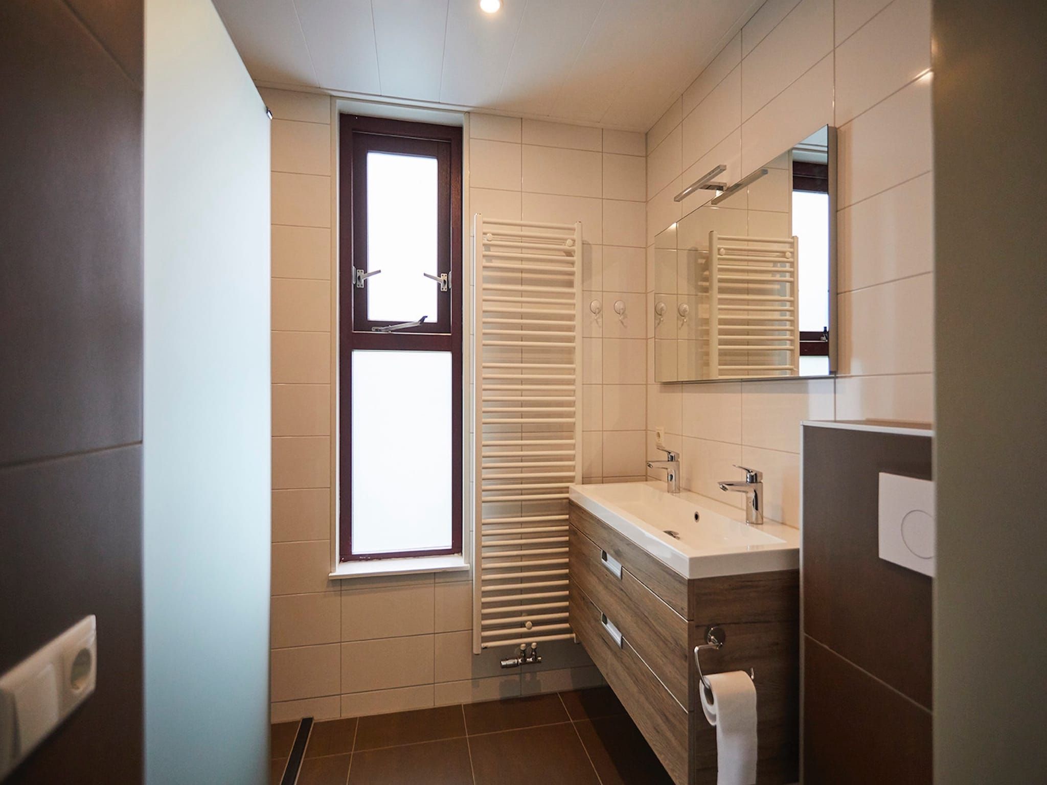 De badkamer van Vakantiepark Hof van Zeeland 5 in Heinkenszand