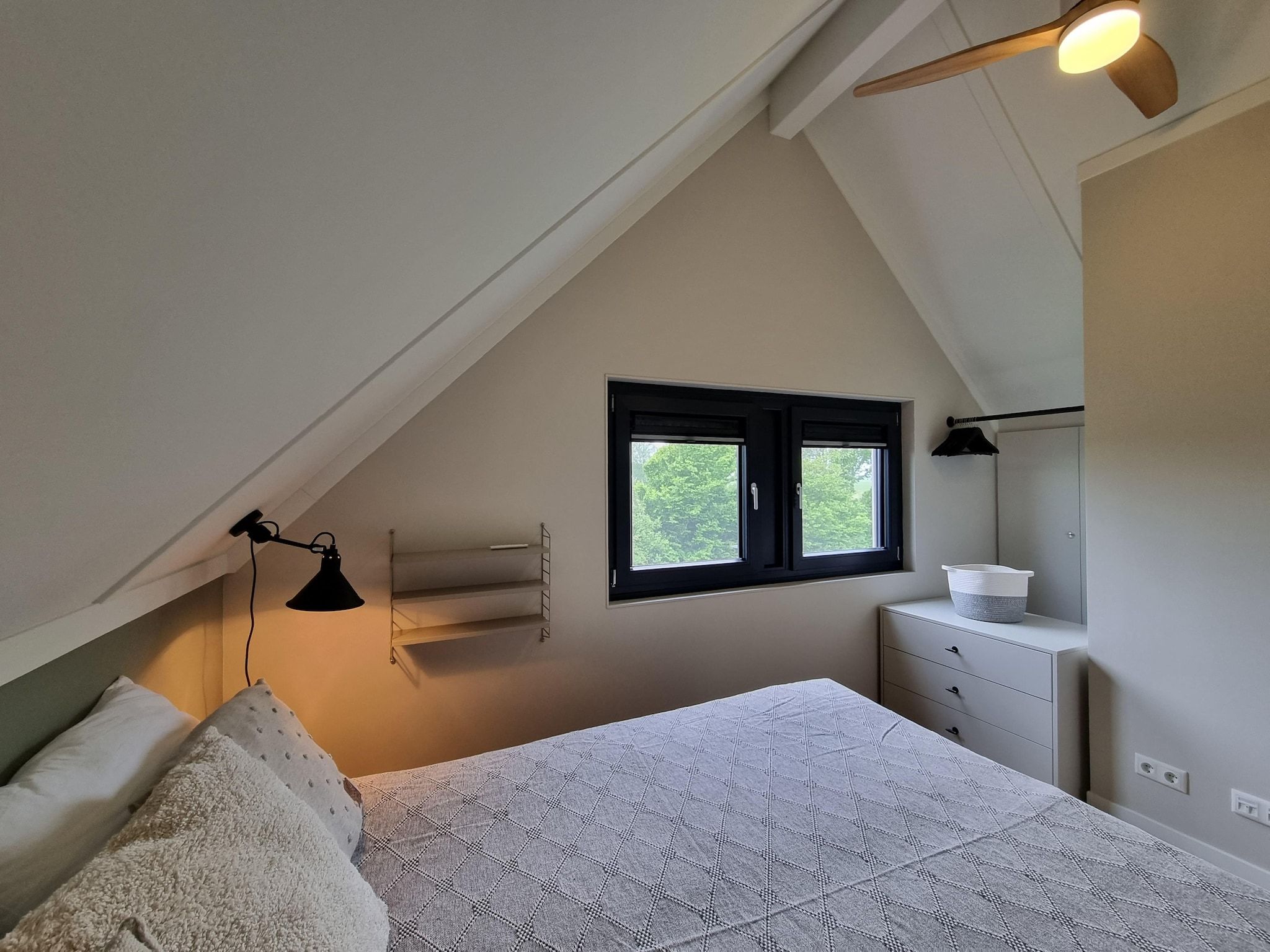 Een slaapkamer van Watervilla Acht in Balk