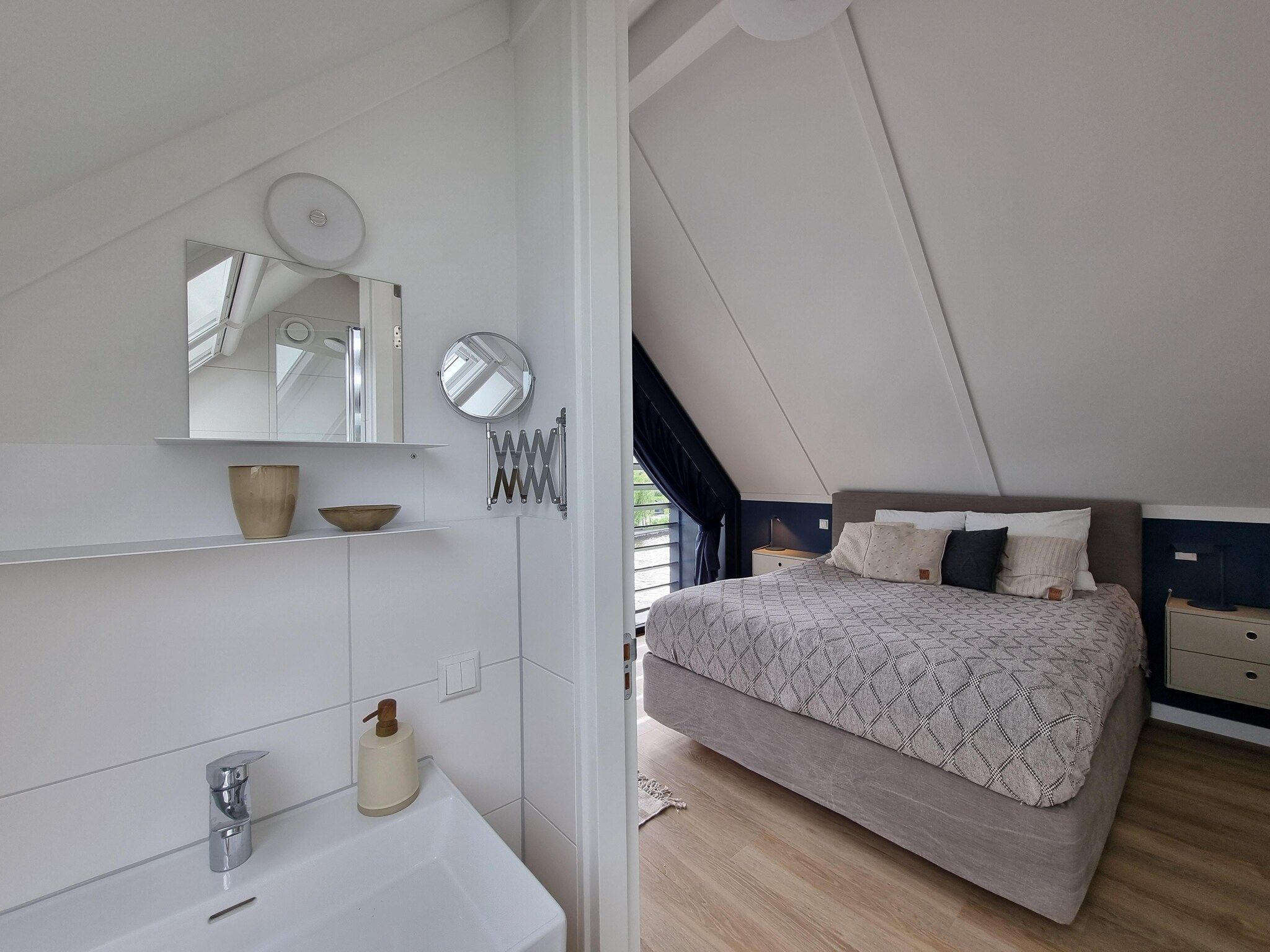 Een slaapkamer van Watervilla Acht in Balk
