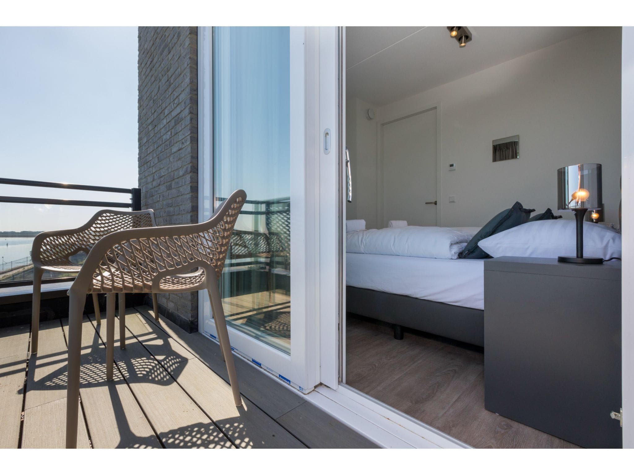 Een slaapkamer van Havenweg 8-16 in St. Annaland