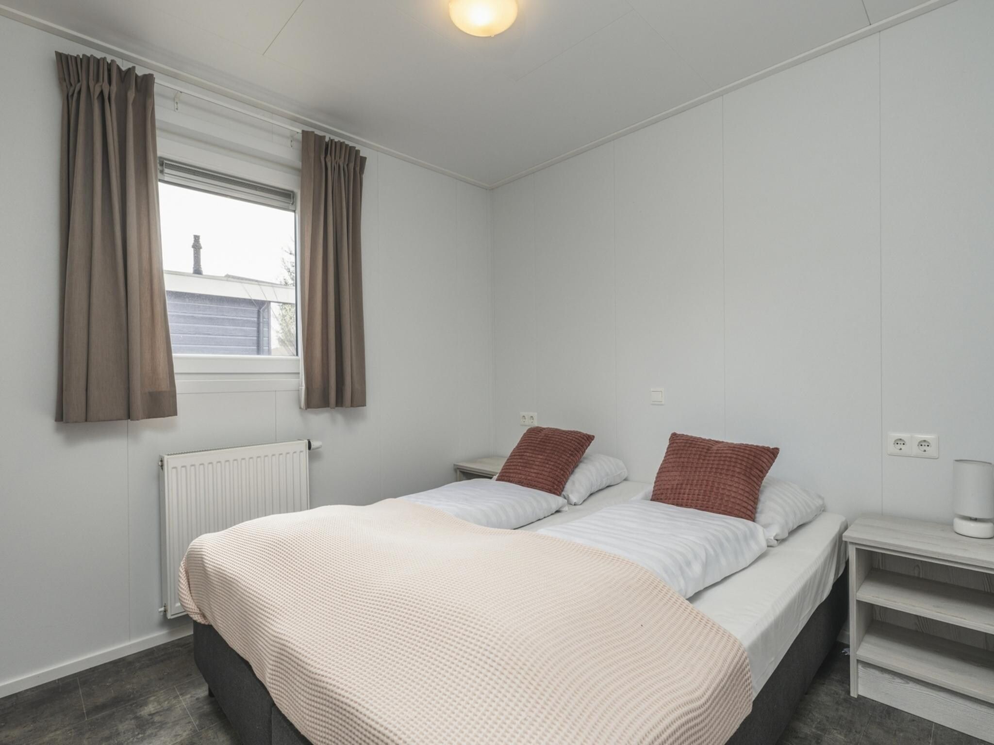 Een slaapkamer van Vakantiepark Mölke 30 in Zuna