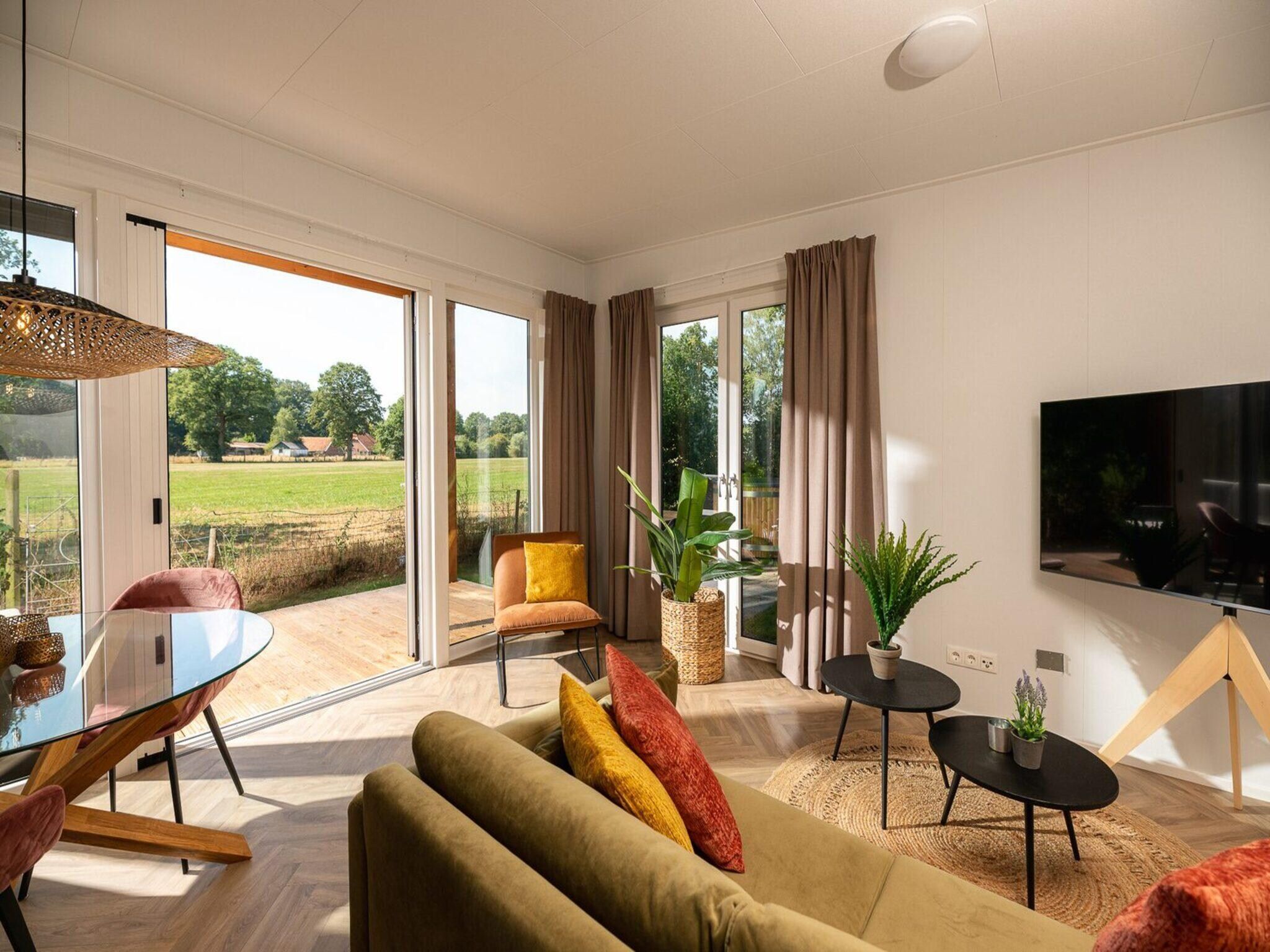 De woonkamer van Vakantiepark Mölke 30 in Zuna