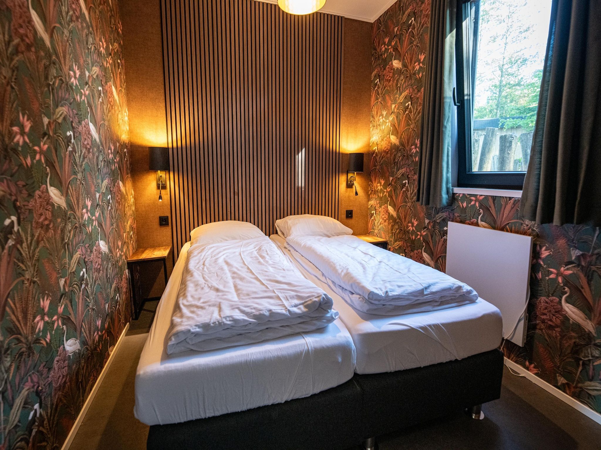 Een slaapkamer van Wellnesslodge Scholekster 4p in Dalerveen