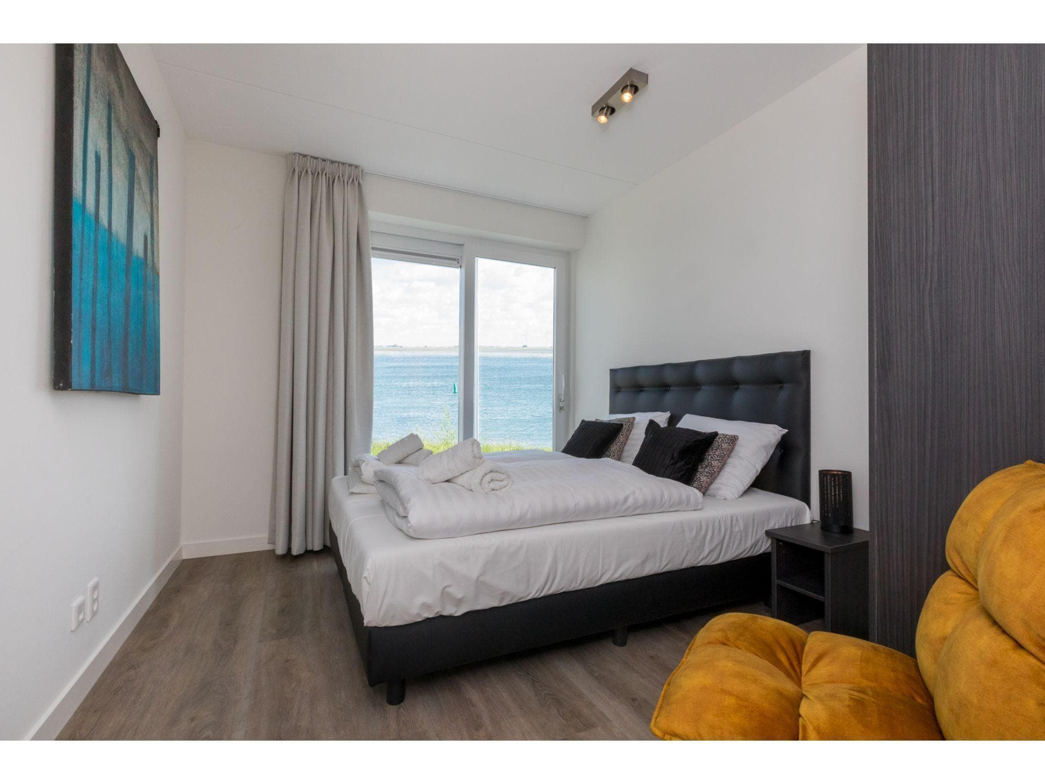 Een slaapkamer van Havenweg 8-18 in St. Annaland