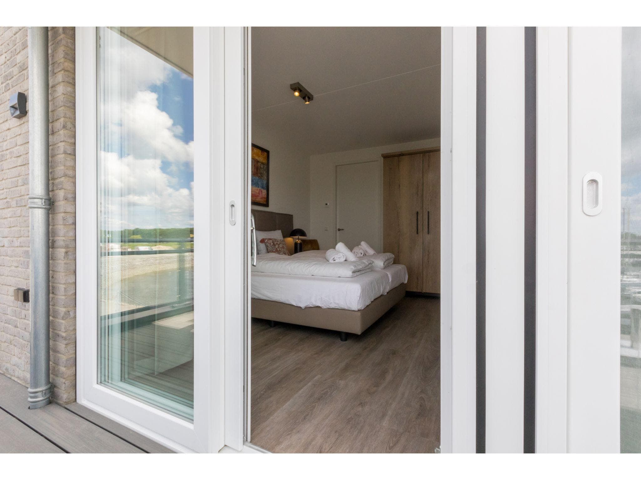 Een slaapkamer van Havenweg 8-18 in St. Annaland