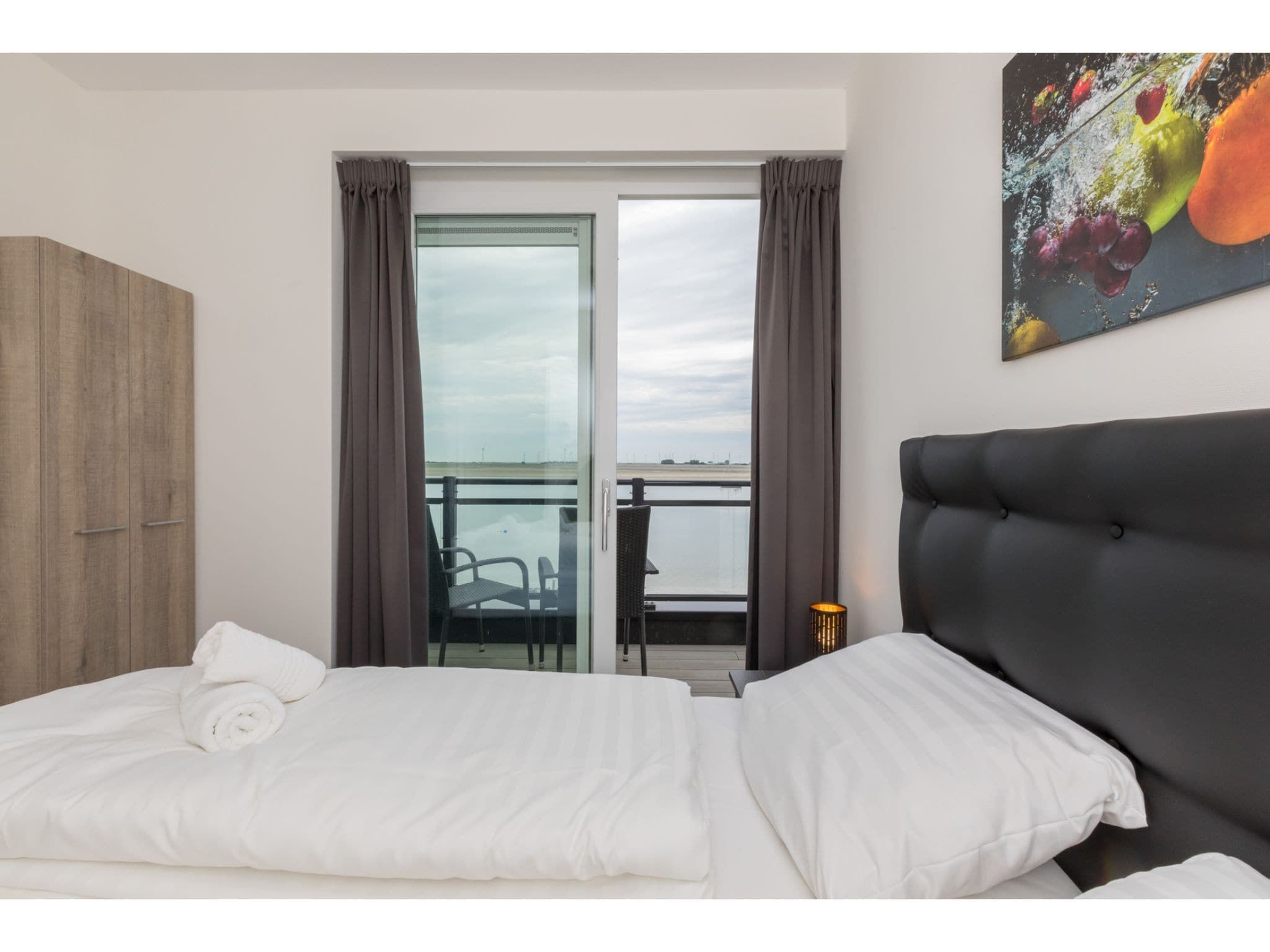 Een slaapkamer van Havenweg 8-22 in St. Annaland