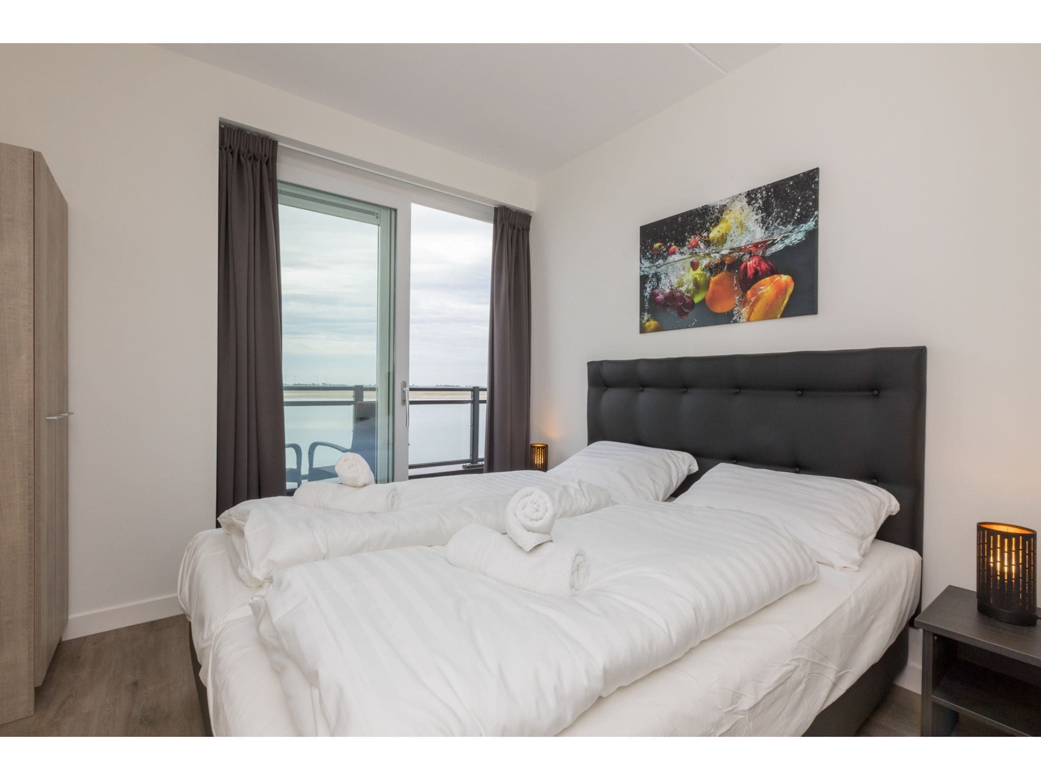 Een slaapkamer van Havenweg 8-22 in St. Annaland