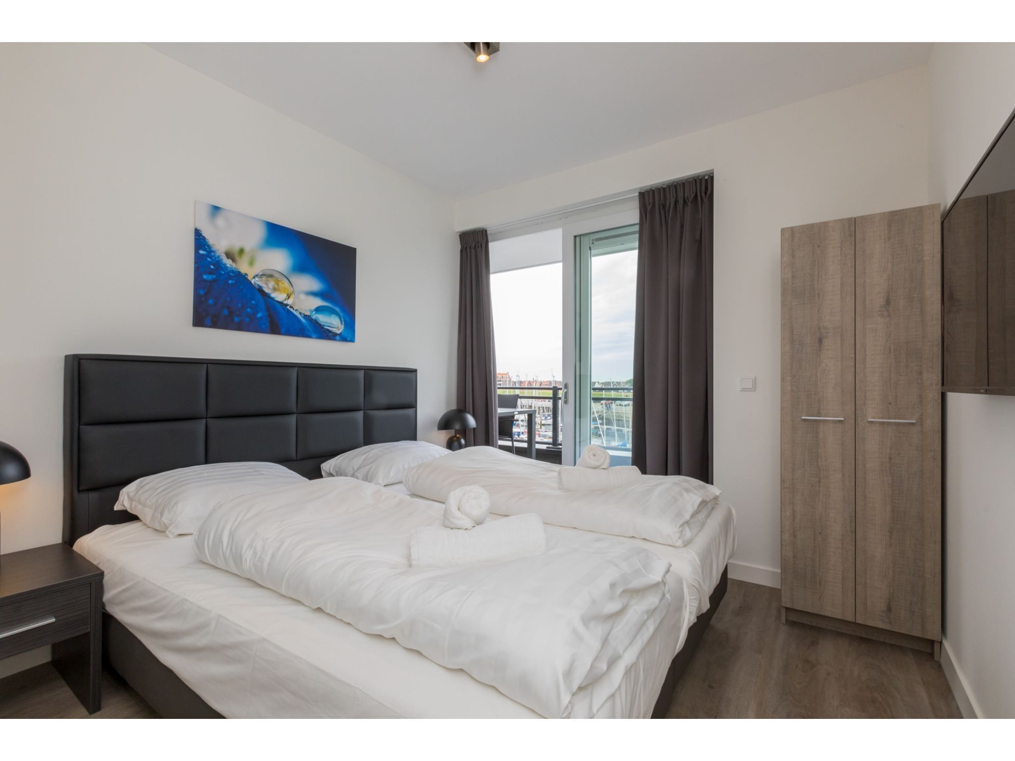 Een slaapkamer van Havenweg 8-22 in St. Annaland