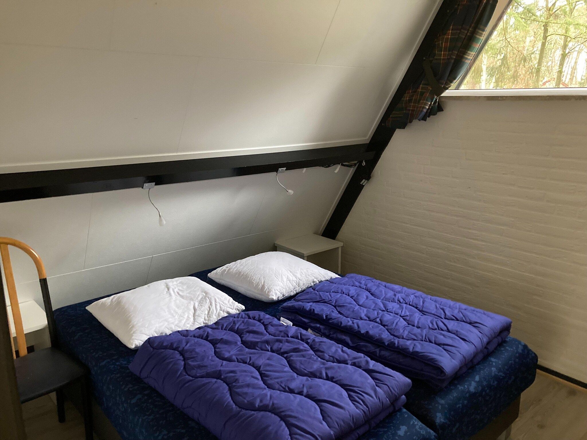 Een slaapkamer van Vosseven 73 Maretak in Stramproy