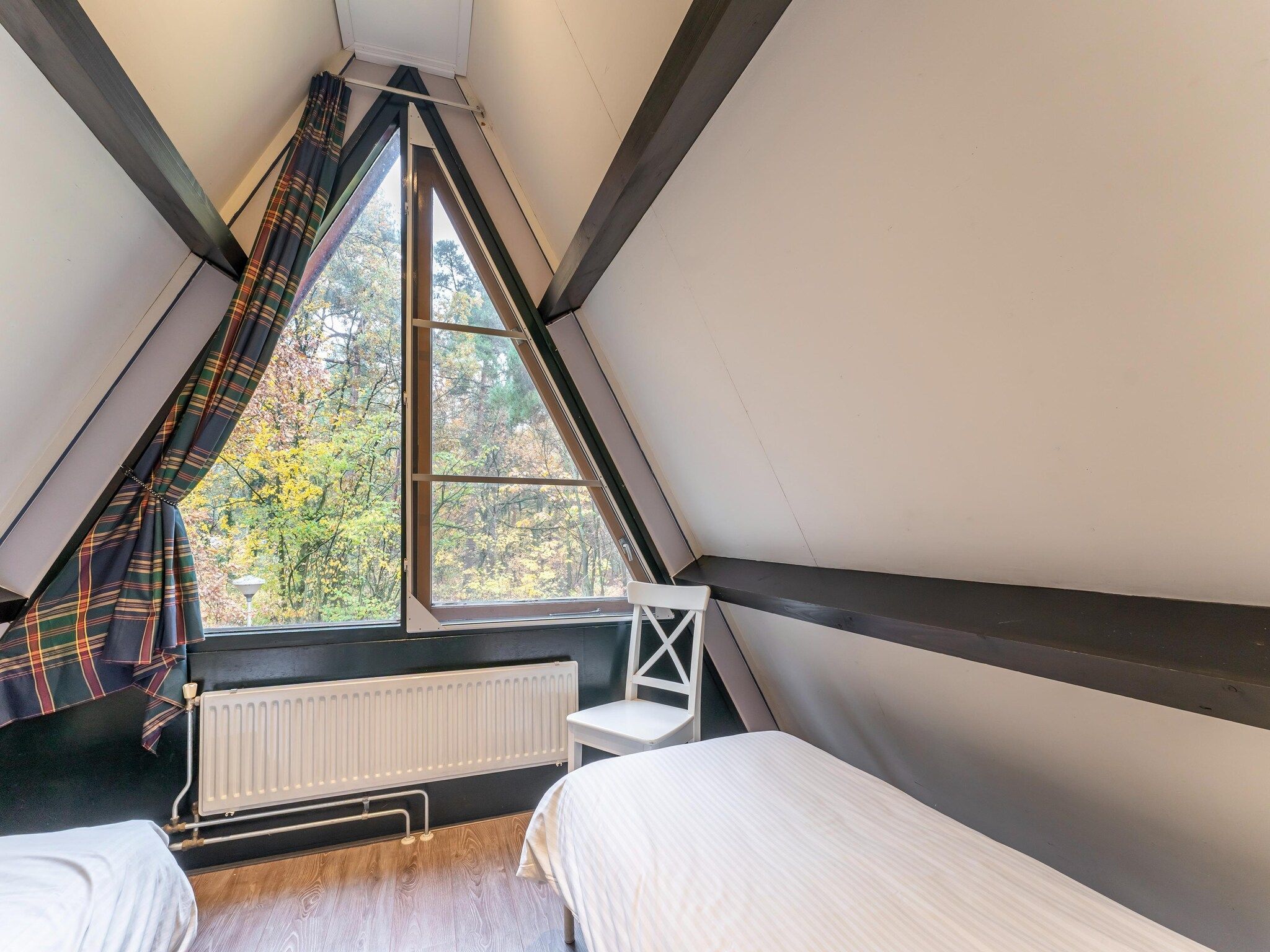 Een slaapkamer van Vosseven 73 Maretak in Stramproy
