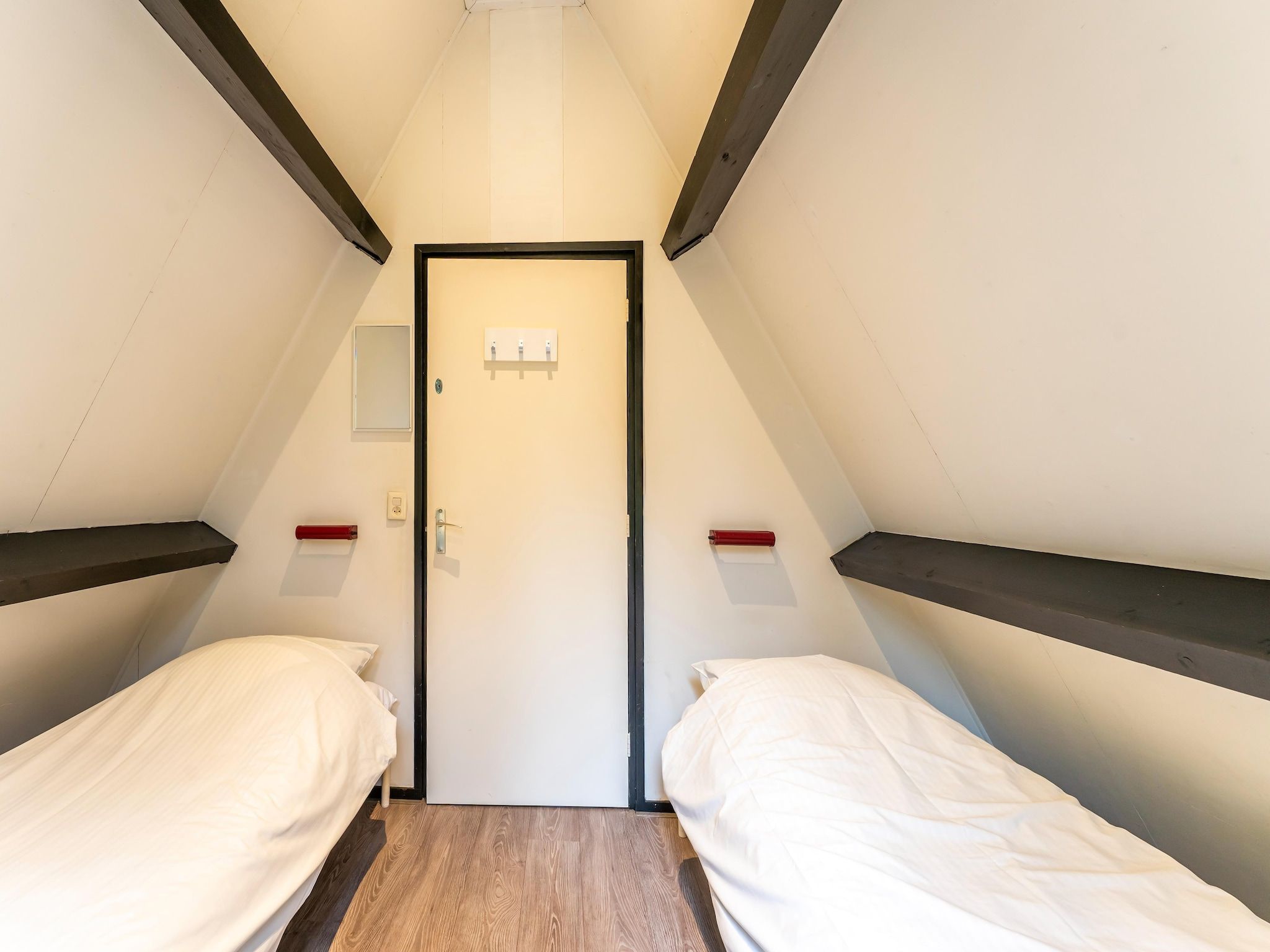 Een slaapkamer van Vosseven 73 Maretak in Stramproy