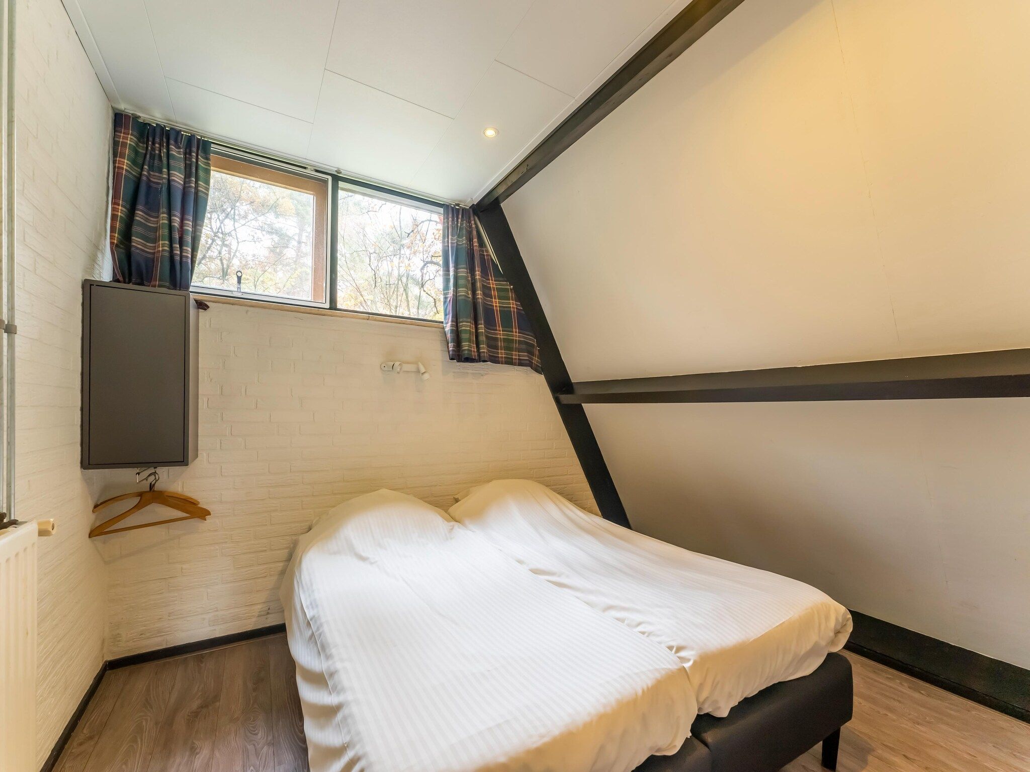 Een slaapkamer van Vosseven 73 Maretak in Stramproy
