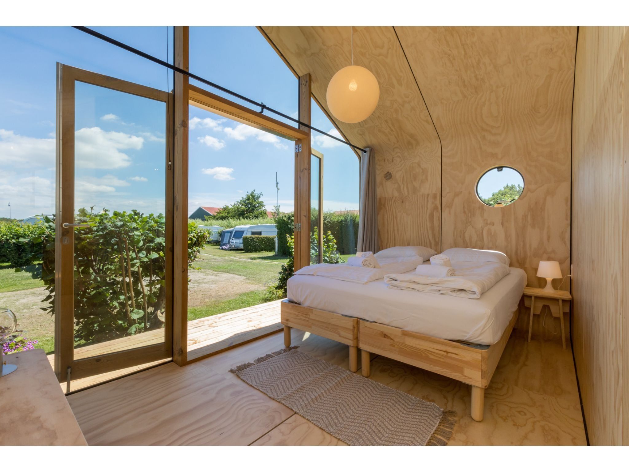 Een slaapkamer van Wikkelhouse - Kon Emmaweg 6  Vrouwenpolder in Vrouwenpolder