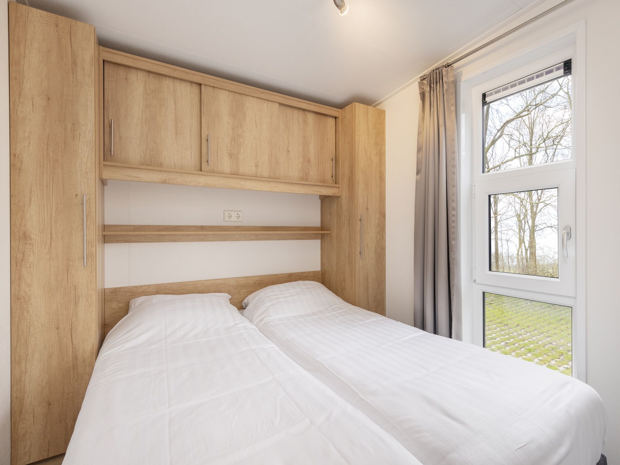 Een slaapkamer van Recreatiepark Tolplas 20 in Hoge Hexel
