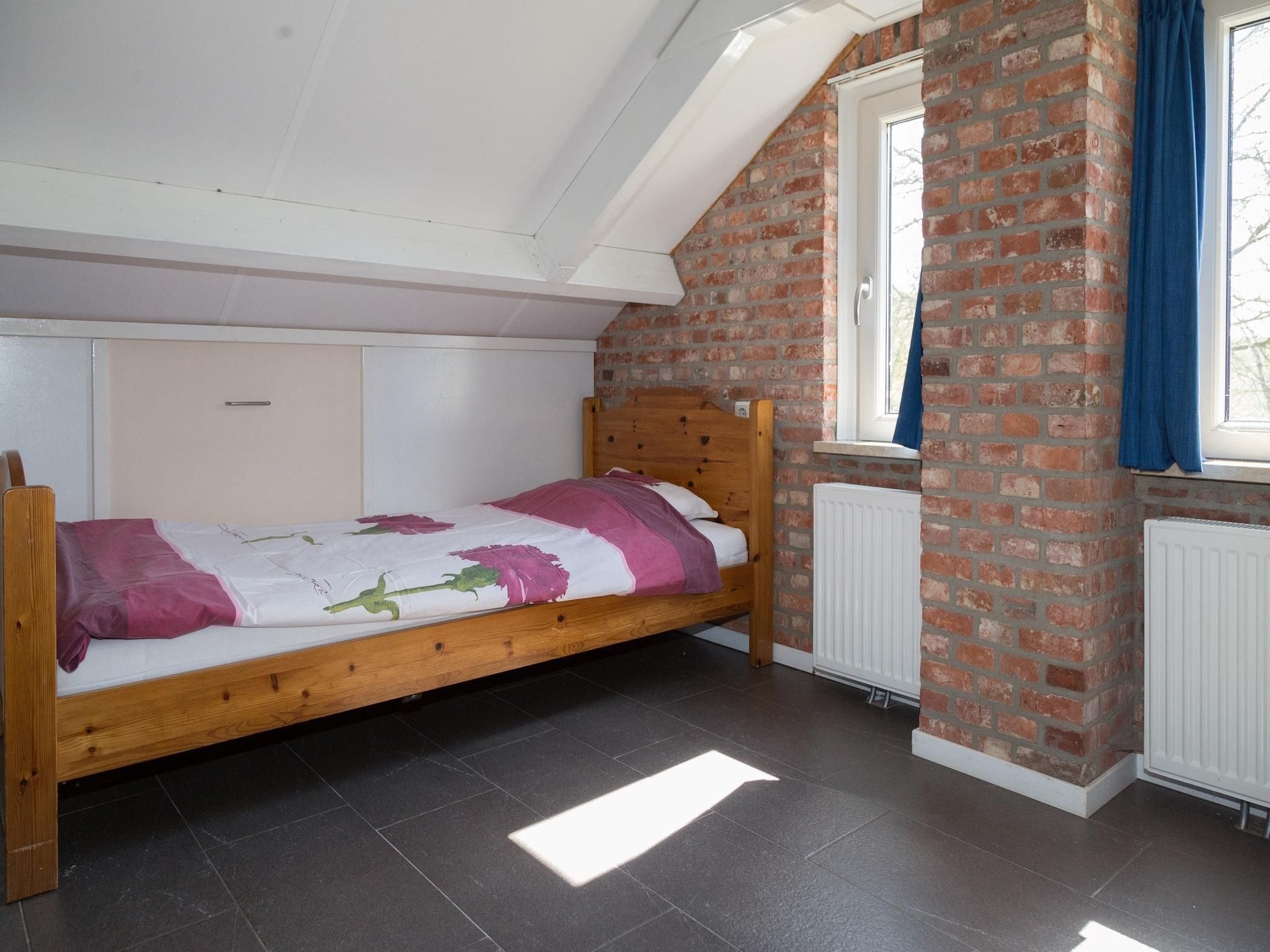 Een slaapkamer van Strandwoning Baarland in Zeeland in Baarland