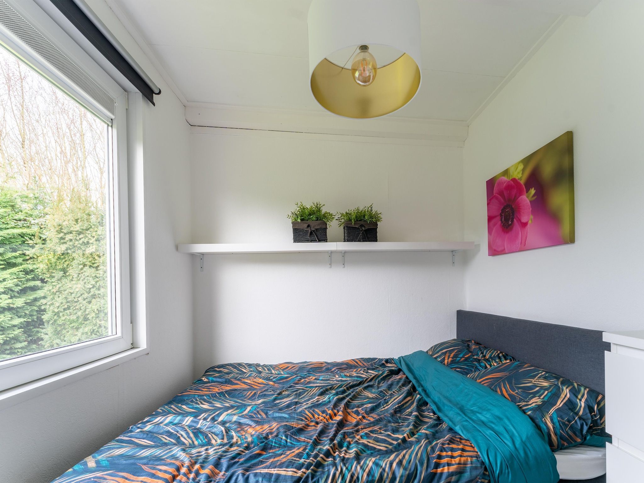 Een slaapkamer van Scheldeoord 97 in Baarland