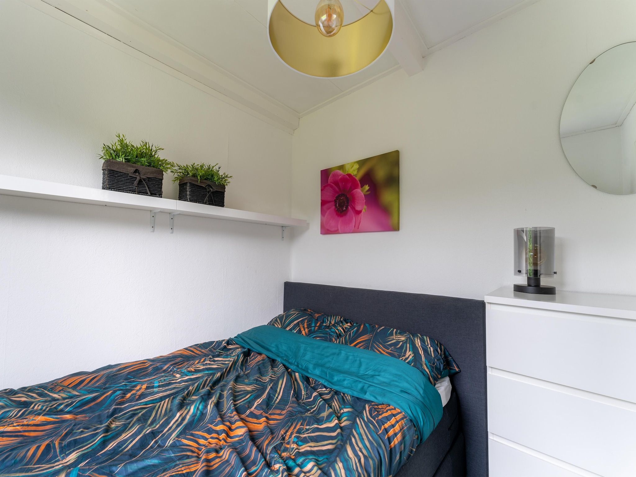 Een slaapkamer van Scheldeoord 97 in Baarland
