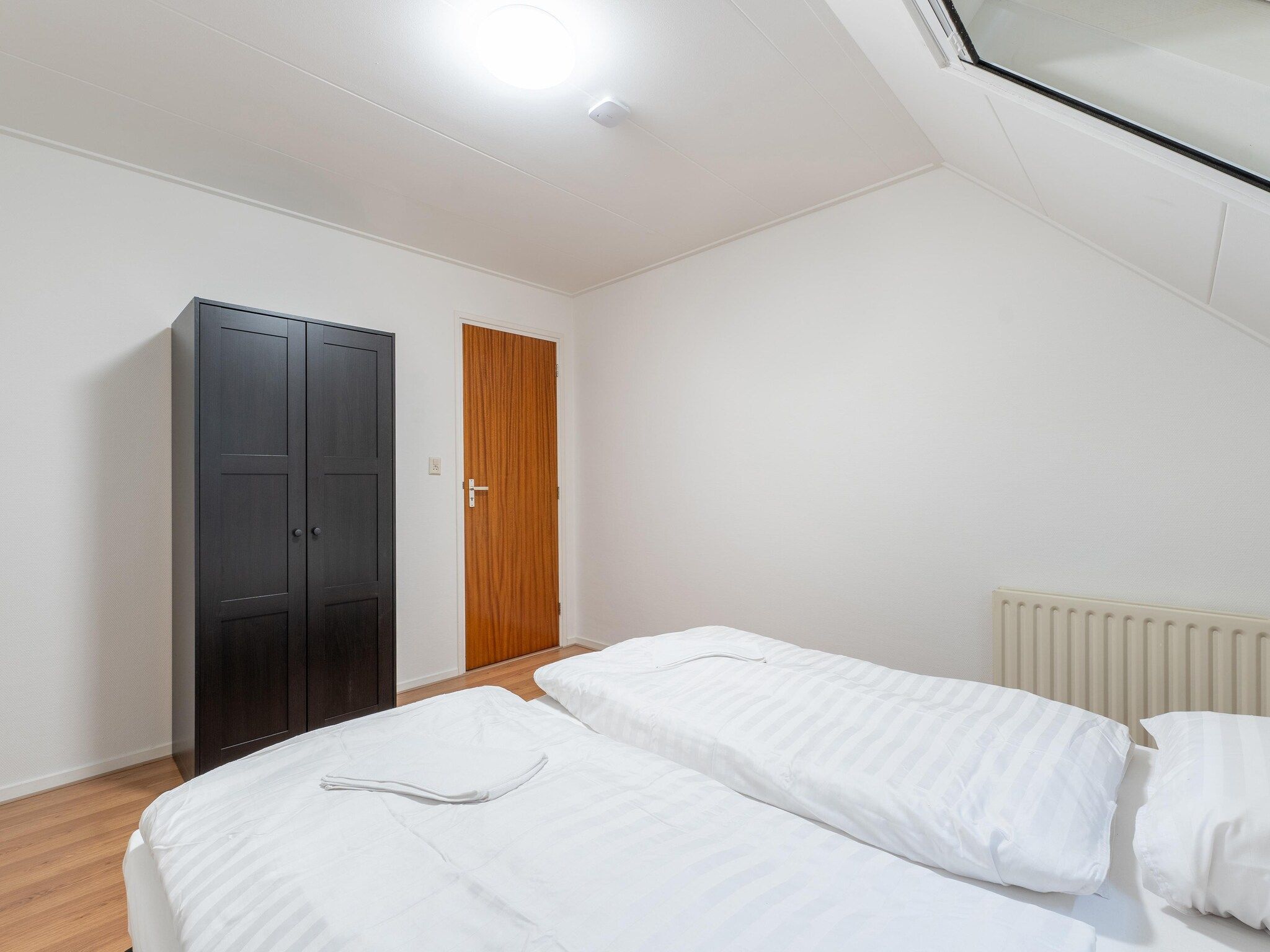 Een slaapkamer van Genieten in Silvolde II in Silvolde