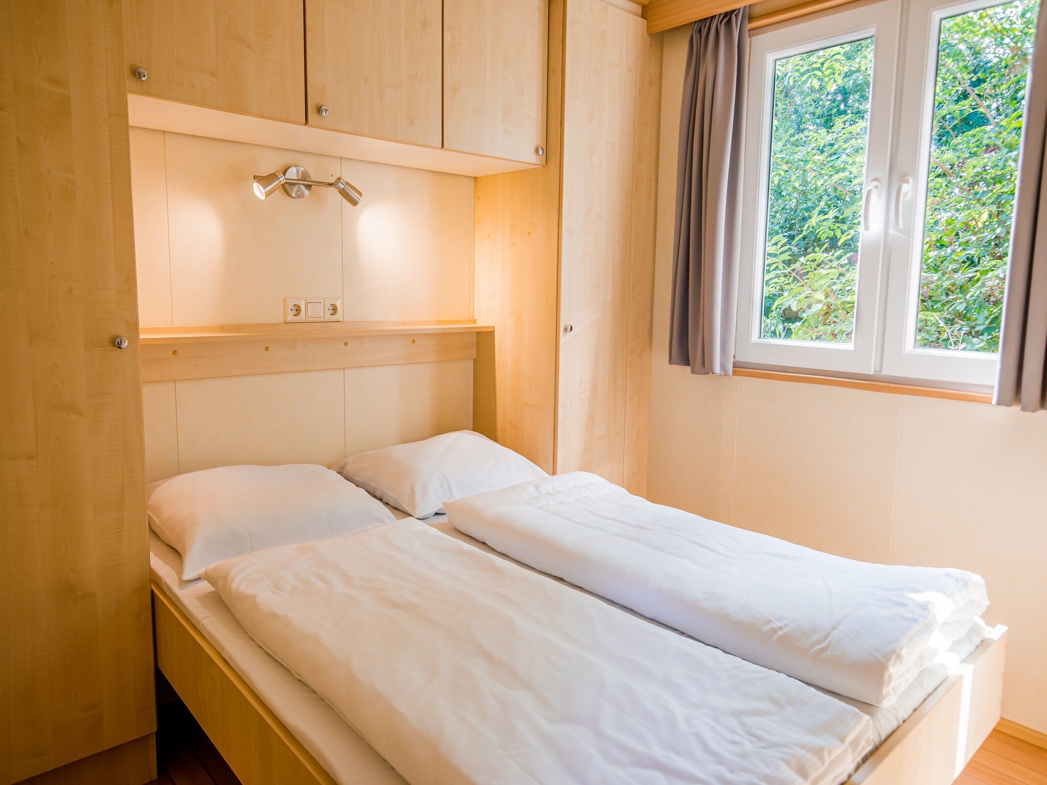 Een slaapkamer van Vakantiepark Leukermeer 3 in Well