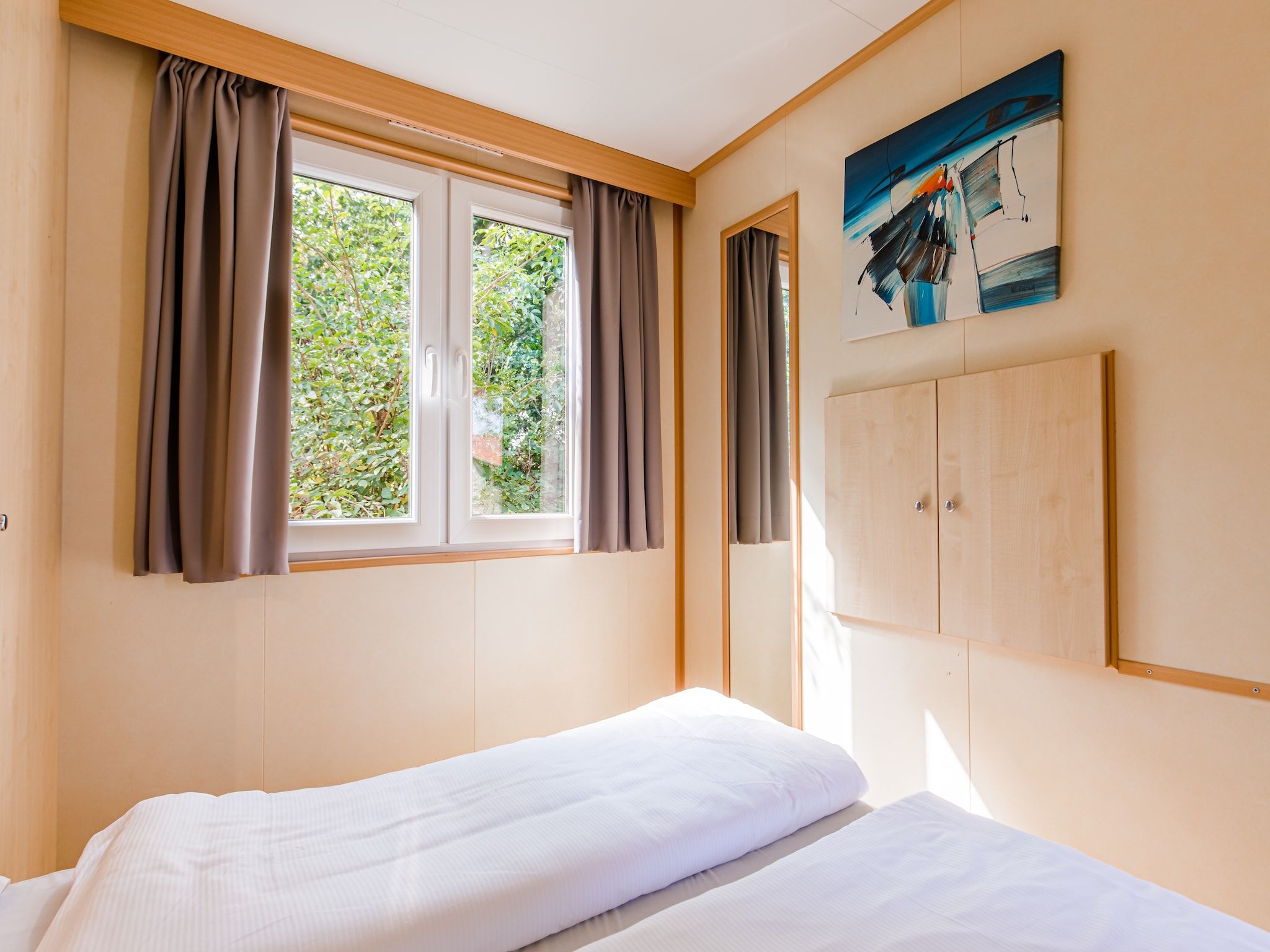 Een slaapkamer van Vakantiepark Leukermeer 3 in Well