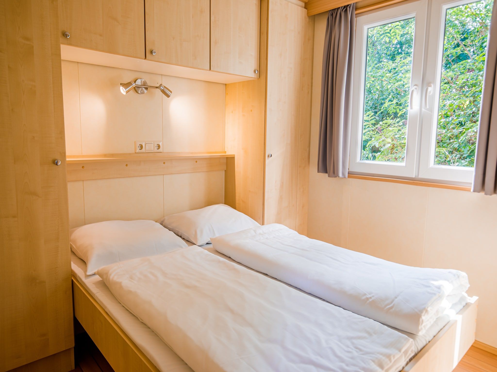 Een slaapkamer van Vakantiepark Leukermeer 5 in Well